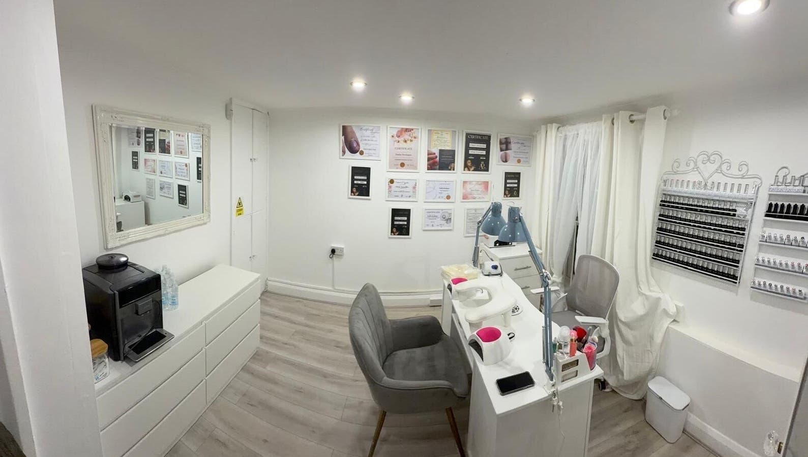 Elegant nail salon interior at Nail Room By Emilia, Bletchley, England, GB with manicure station and decor.