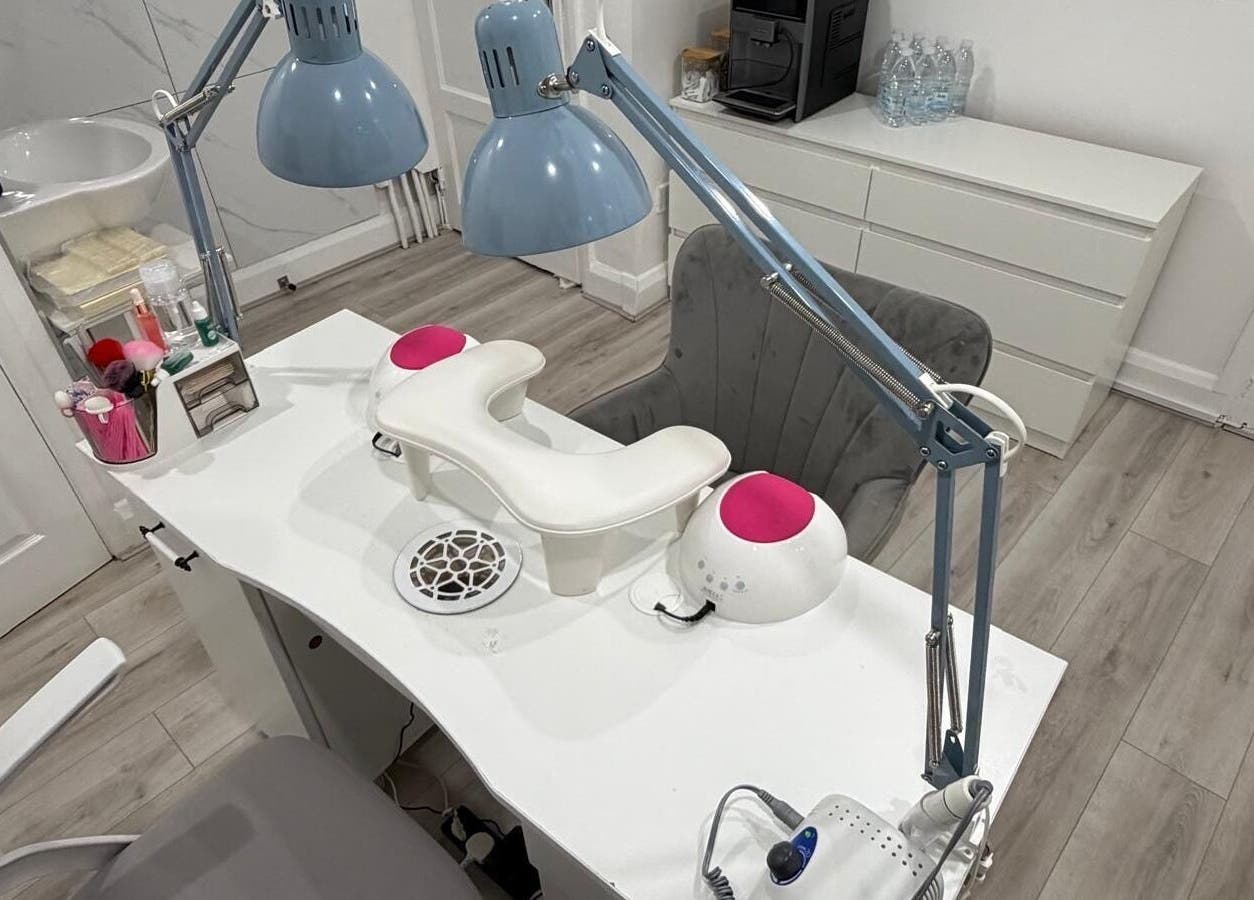 Modern nail station at Nail Room By Emilia, Bletchley, England, GB, featuring manicure tools and lighting.