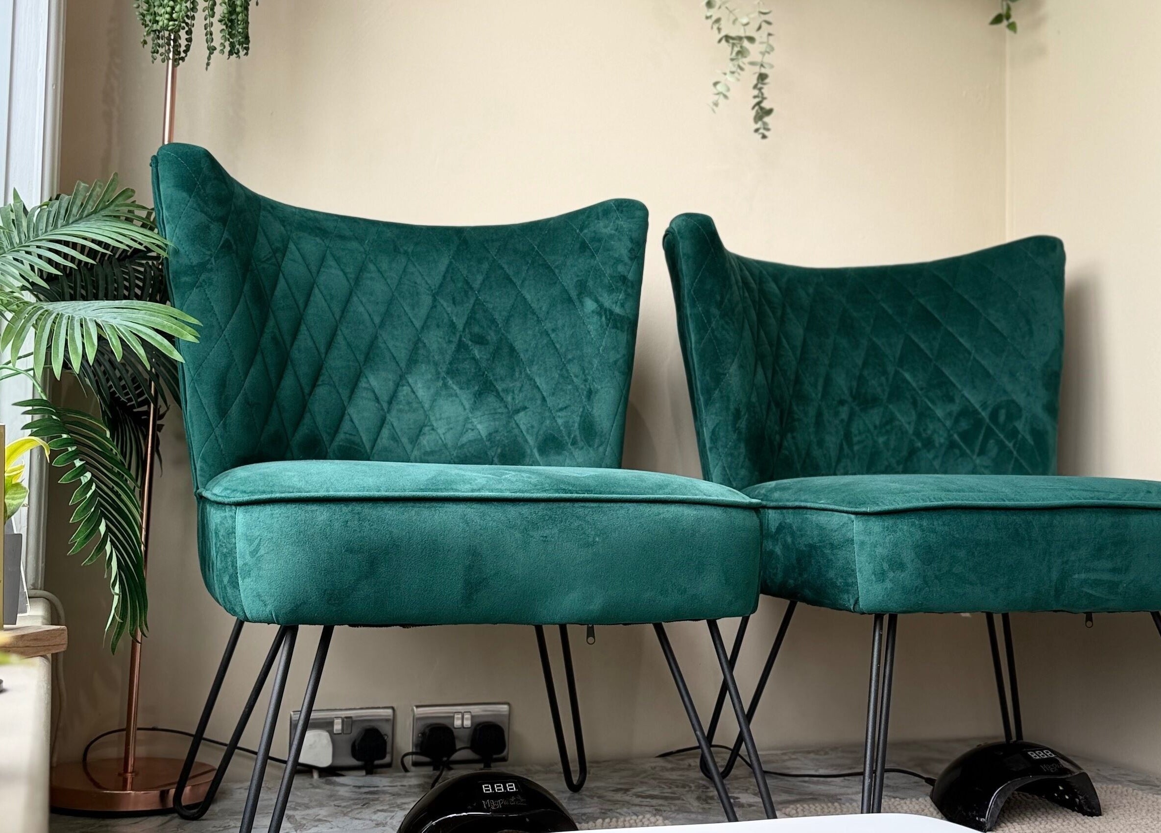Elegant green chairs at SB Wellbeing in Chesterfield, England, GB, creating a relaxing ambiance.