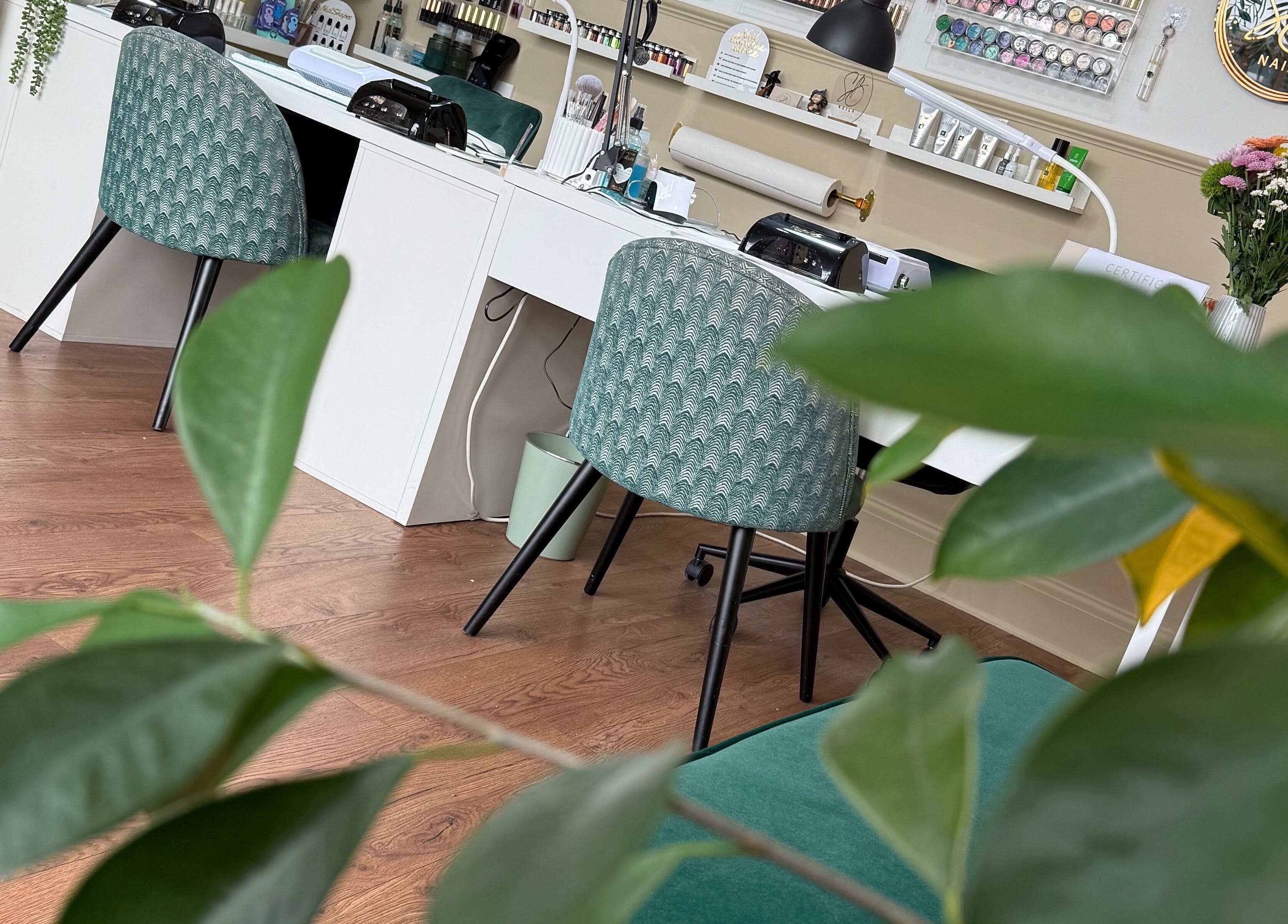 Modern salon workspace at SB Wellbeing / SB Academy, Chesterfield, England, GB with elegant decor and greenery.