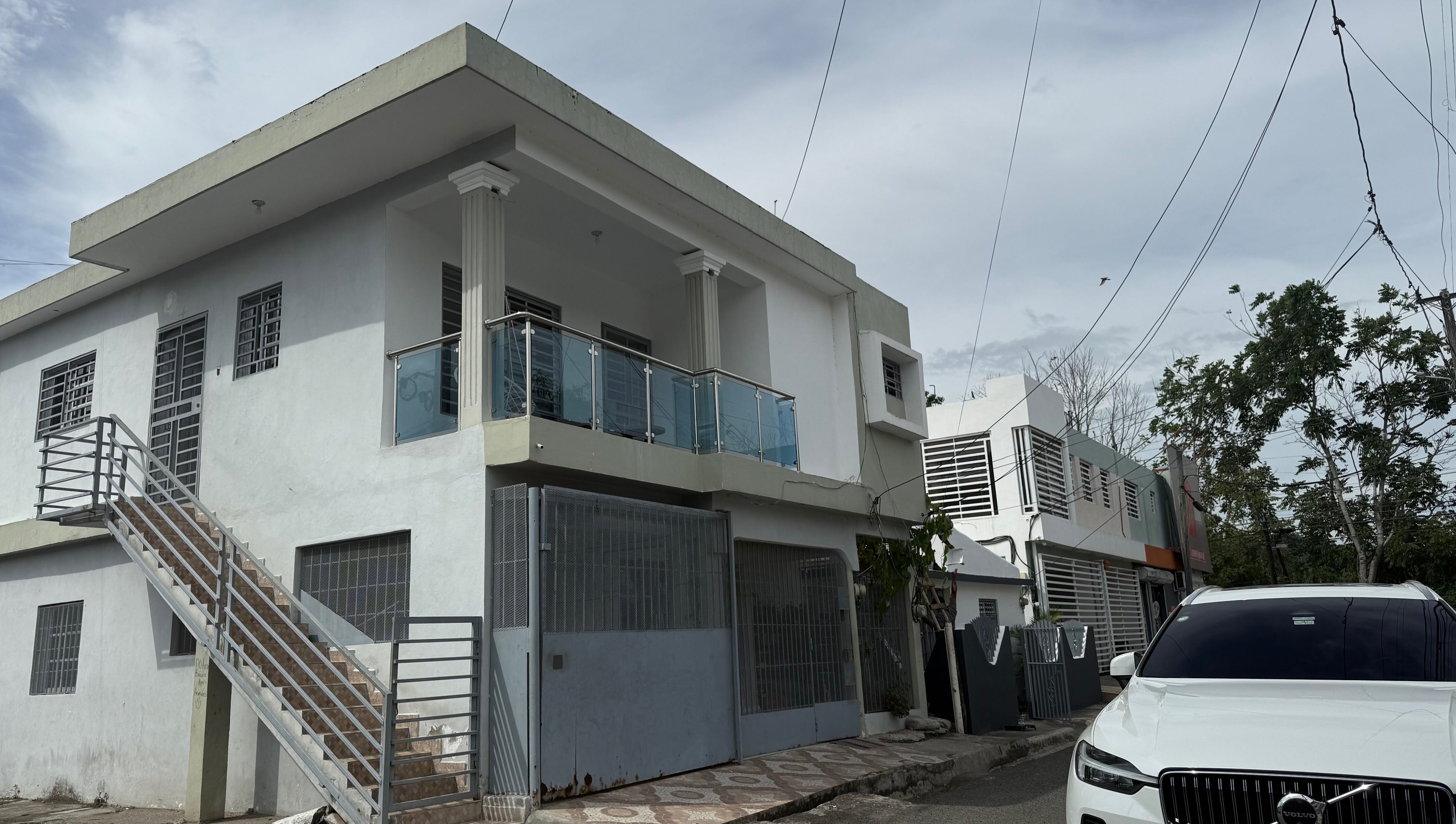 Exterior view of Mariaglam Studio in Bonao, Monseñor Nouel, DO, showcasing modern architecture and sleek design.