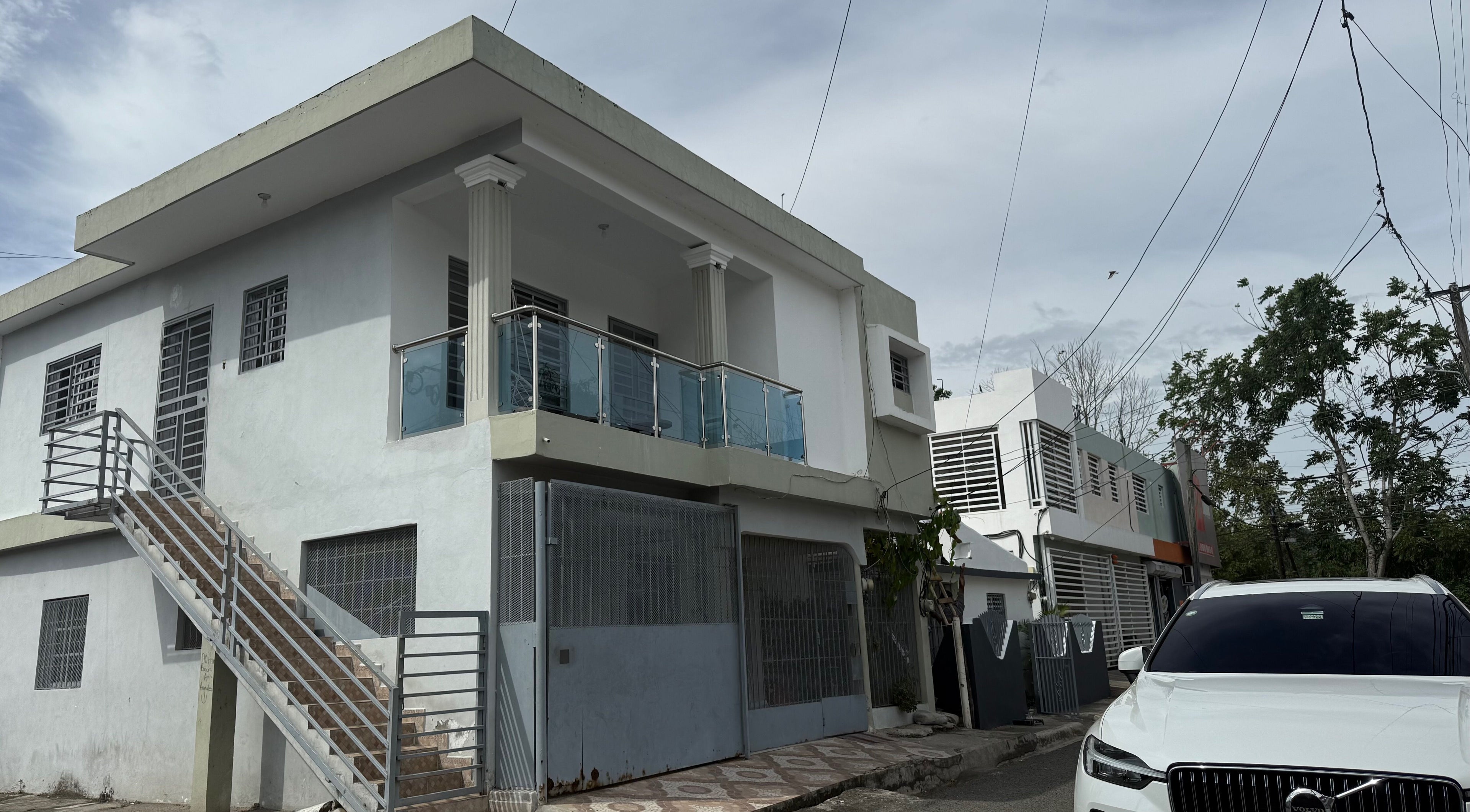 Exterior view of Mariaglam Studio in Bonao, Monseñor Nouel, DO, showcasing modern architecture and sleek design.