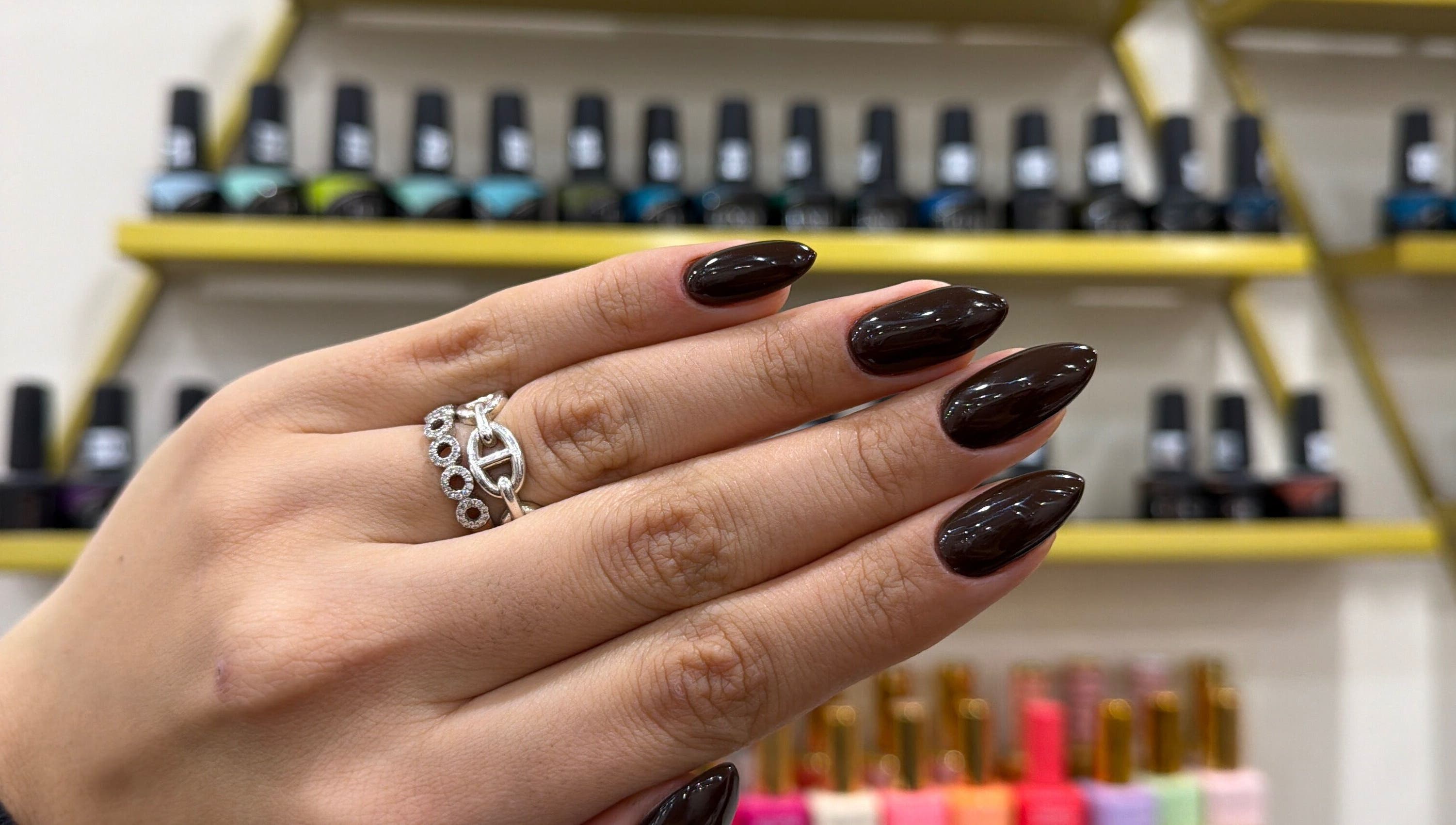 Glossy dark nails with rings at Nails by Ruzan, Glendale, California, US.