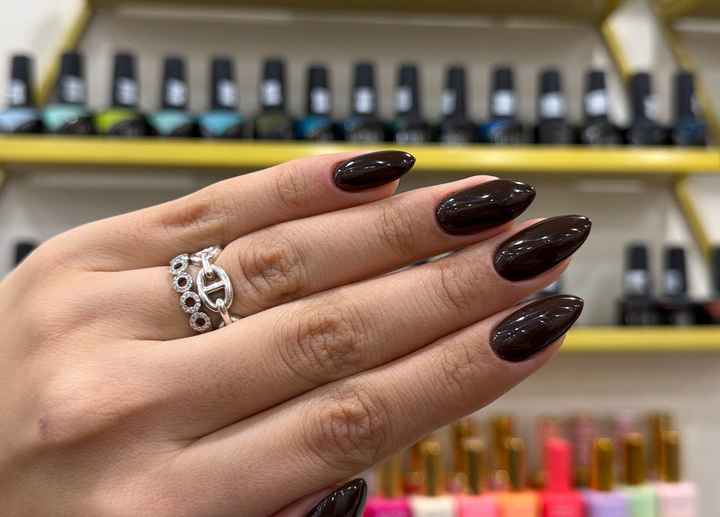 Glossy dark nails with rings at Nails by Ruzan, Glendale, California, US.