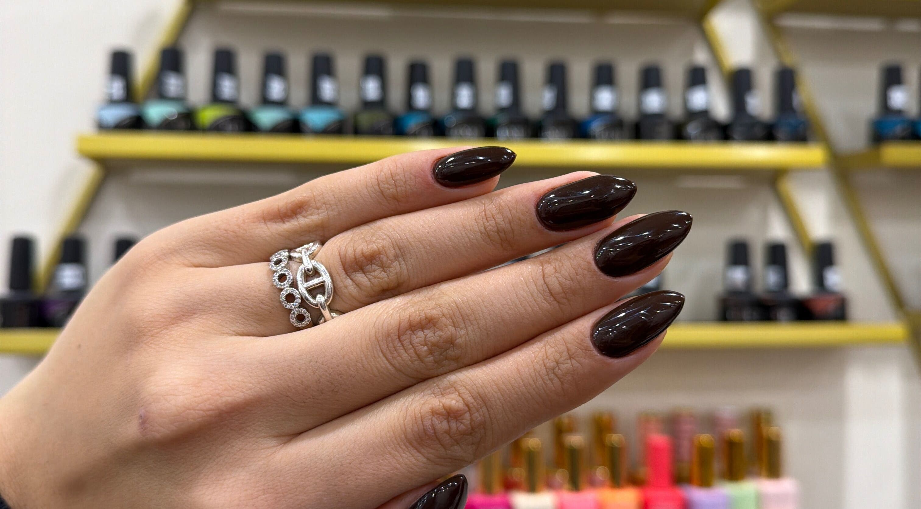 Glossy dark nails with rings at Nails by Ruzan, Glendale, California, US.