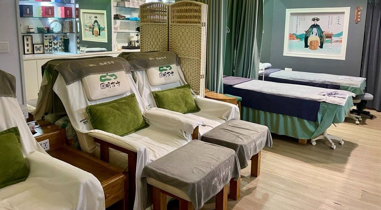 Cozy interior of Lanxi Pavilion Health Centre in Singapore, Singapore, SG, showcasing massage chairs and beds.