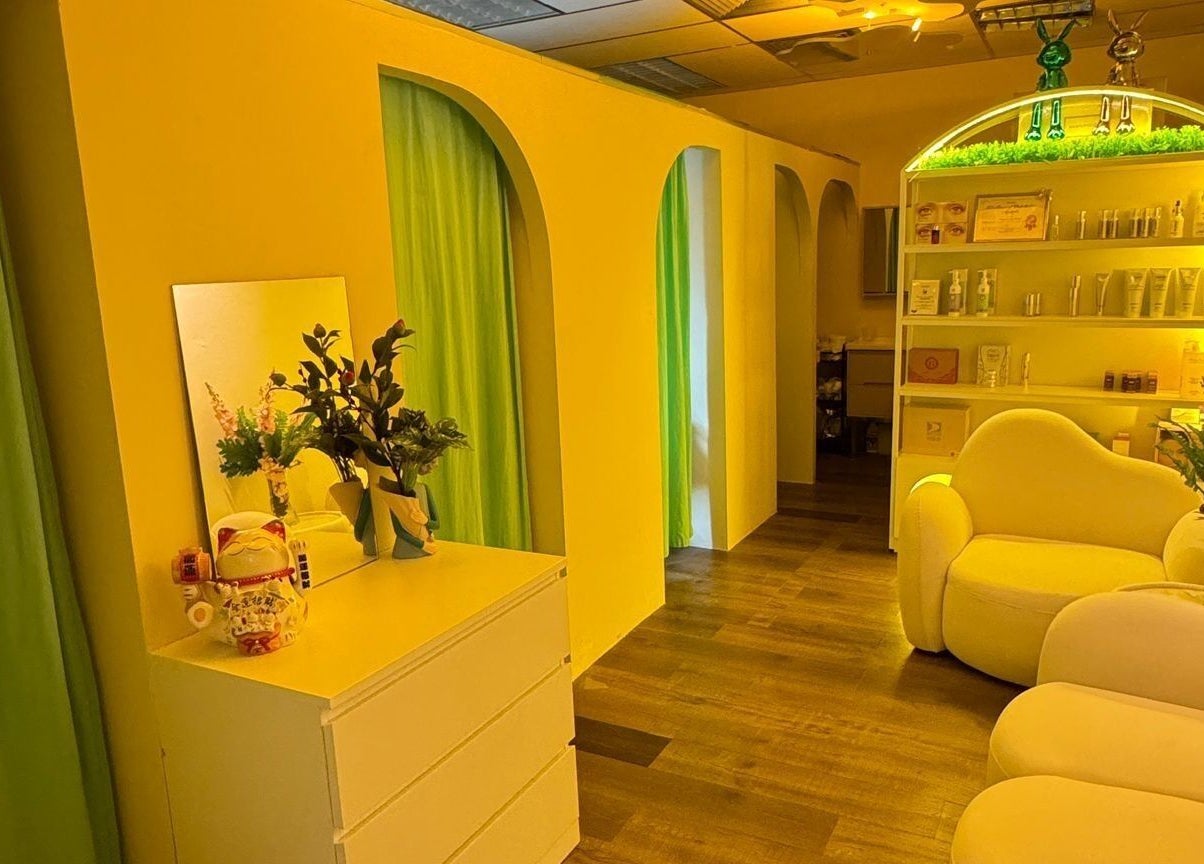 Inviting interior of Lavon Beauty with plush seating and calming yellow walls in Singapore, Singapore, SG.