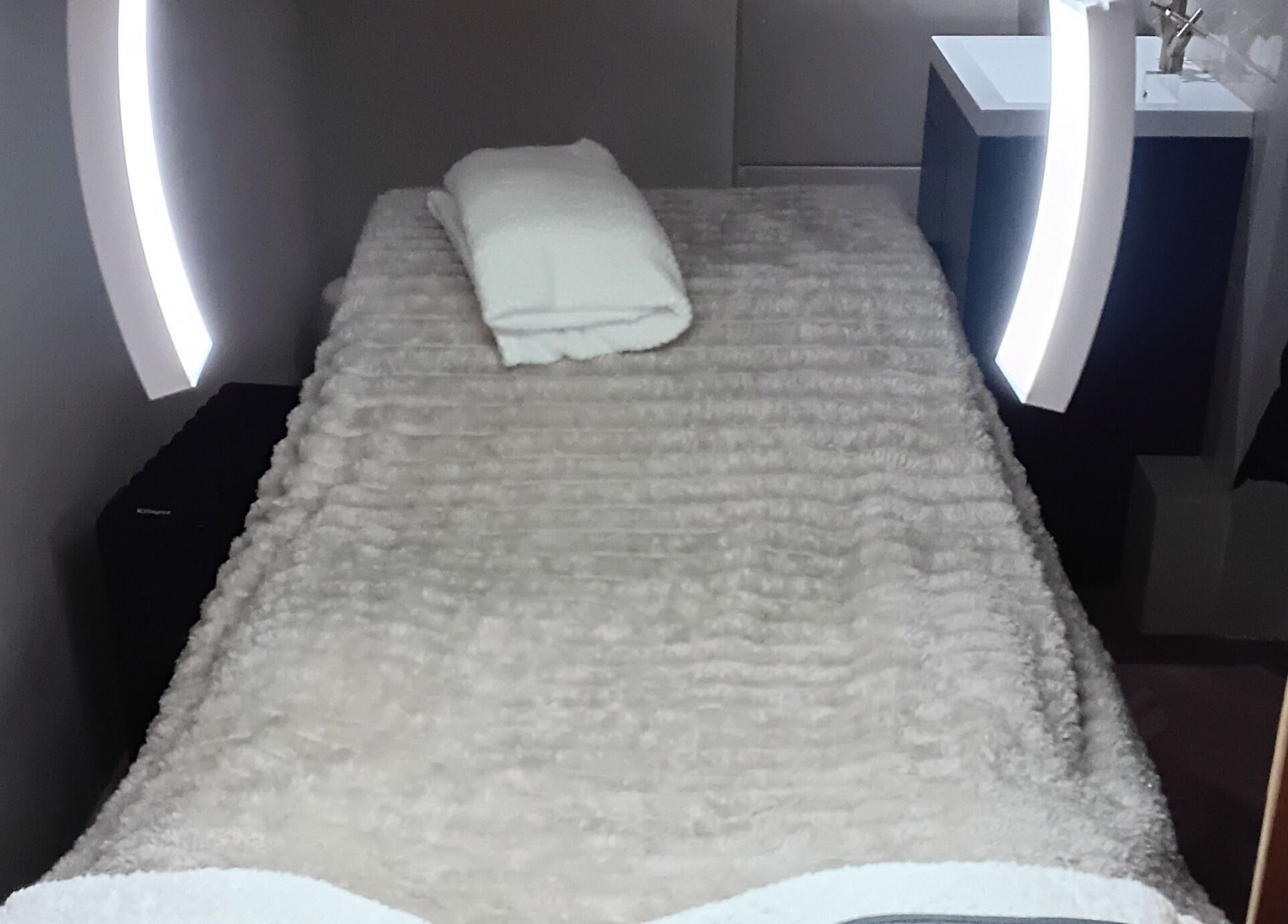 Relaxing treatment room at RK Skin & Sole Ltd in Leeds, England, GB with plush linens and ambient lighting.