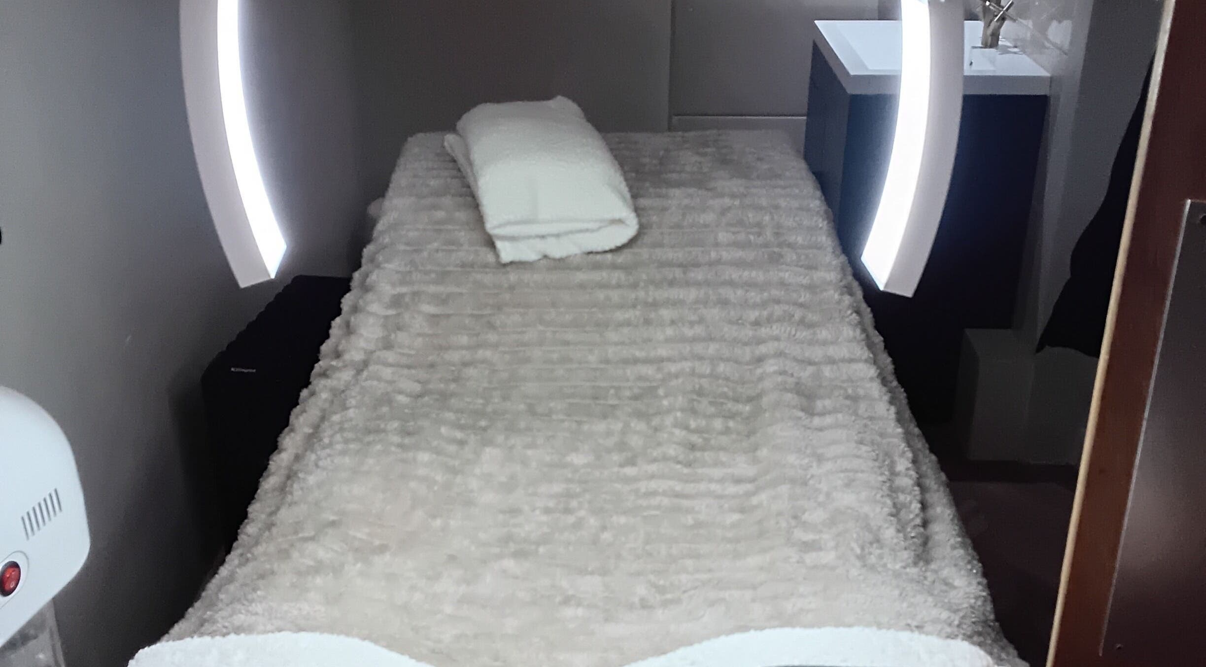 Relaxing treatment room at RK Skin & Sole Ltd in Leeds, England, GB with plush linens and ambient lighting.