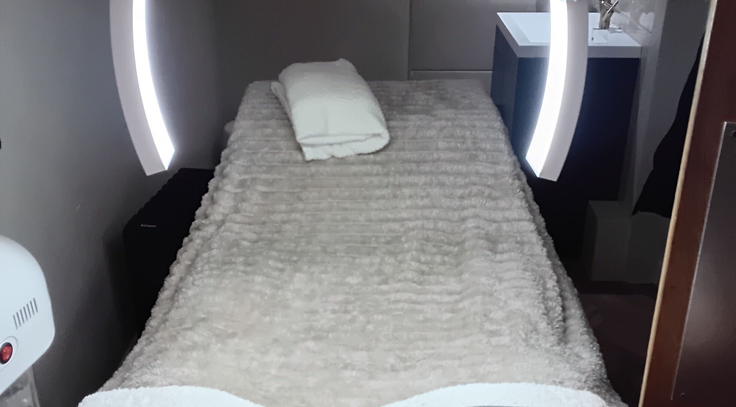 Relaxing treatment room at RK Skin & Sole Ltd in Leeds, England, GB with plush linens and ambient lighting.
