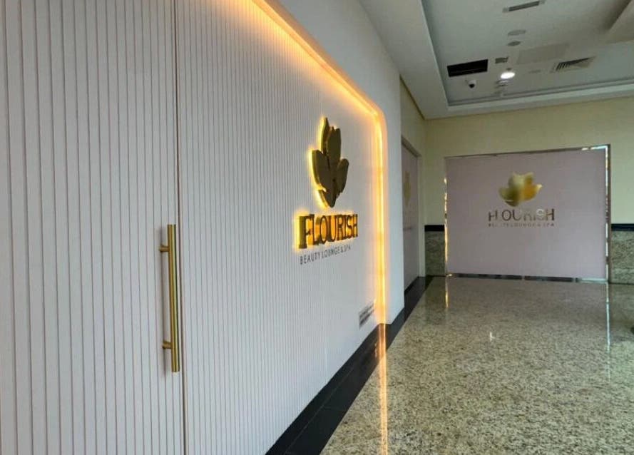 Entrance to Flourish Beauty Lounge & Spa in Dubai, AE, showcasing a luxurious and inviting ambiance.