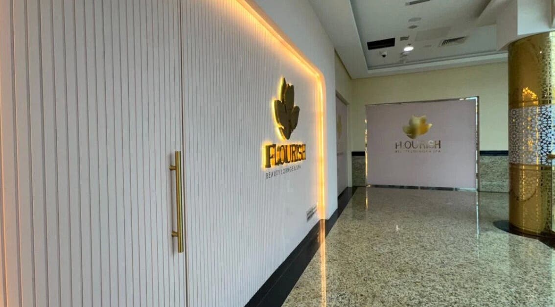 Entrance to Flourish Beauty Lounge & Spa in Dubai, AE, showcasing a luxurious and inviting ambiance.