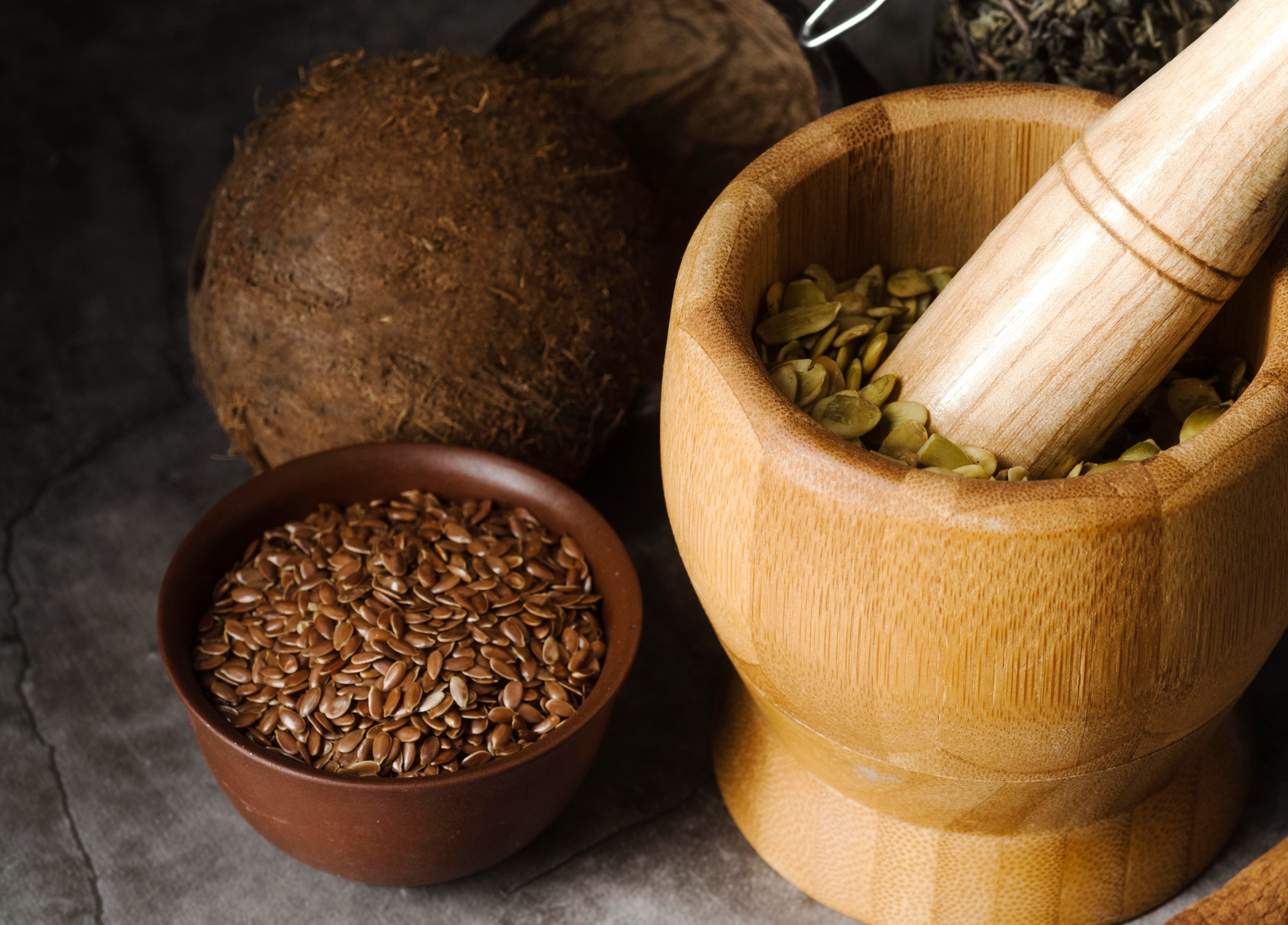 Traditional Healer Near Me in Sandton, Gauteng, ZA offers herbal remedies with mortar and pestle.