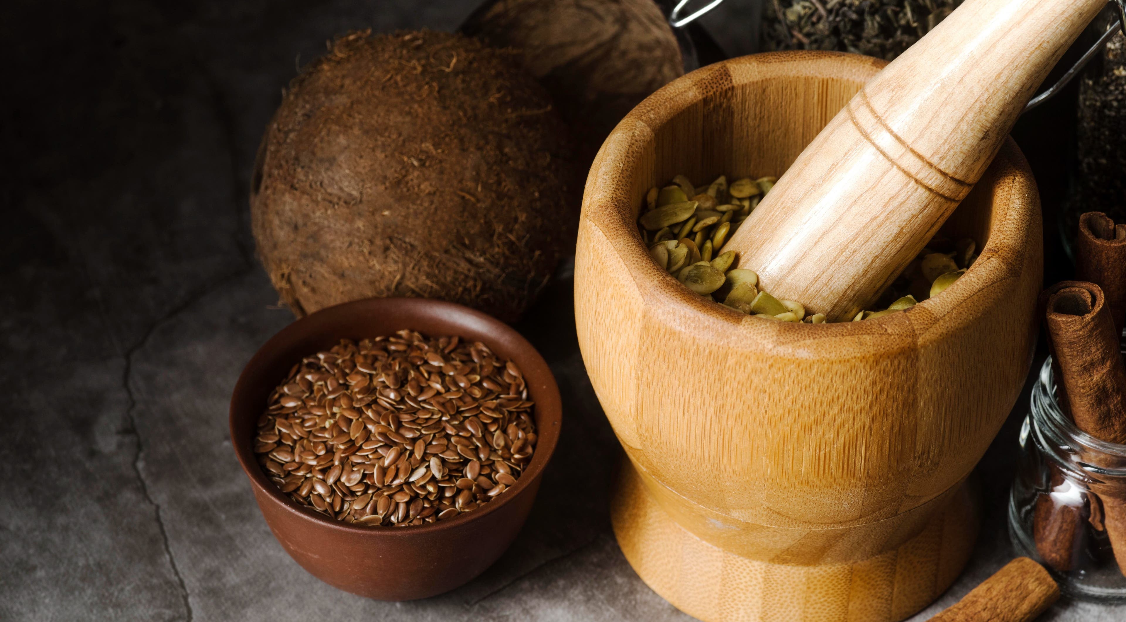 Traditional Healer Near Me in Sandton, Gauteng, ZA offers herbal remedies with mortar and pestle.