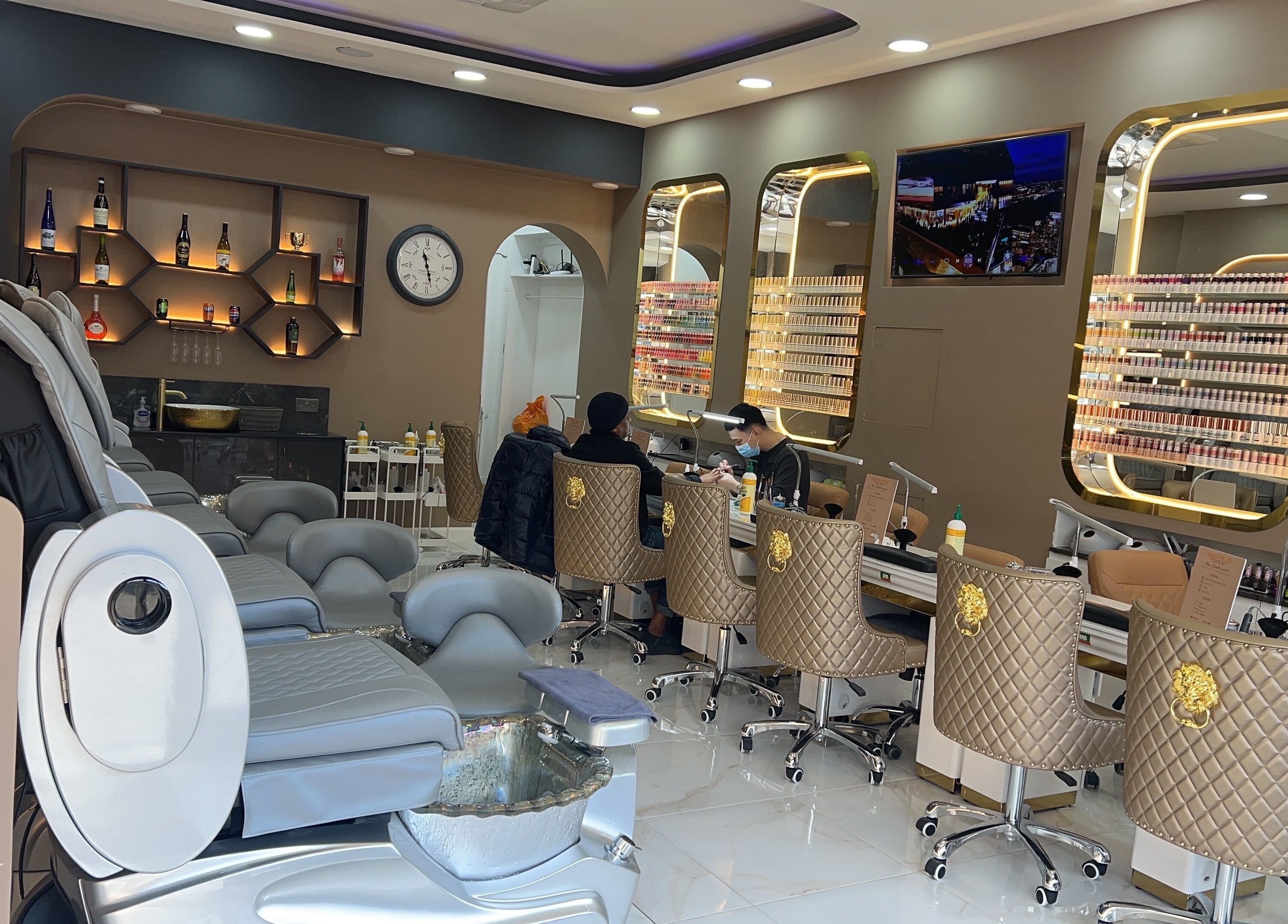 Luxurious interior of Nails Plus in Ruislip, England, GB with stylish chairs and nail polish display.