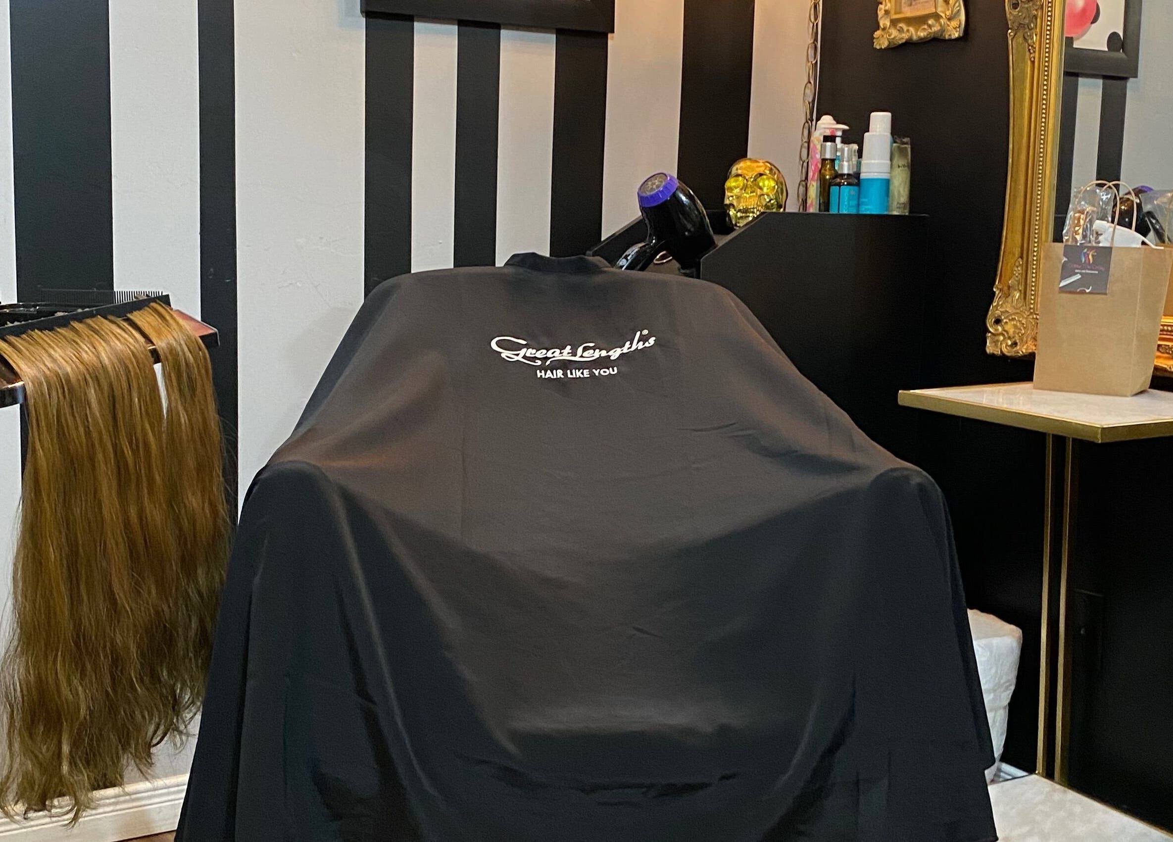 Styling chair at The Coven Extension Studio, Ottawa, Ontario, CA with hair extensions and beauty products.