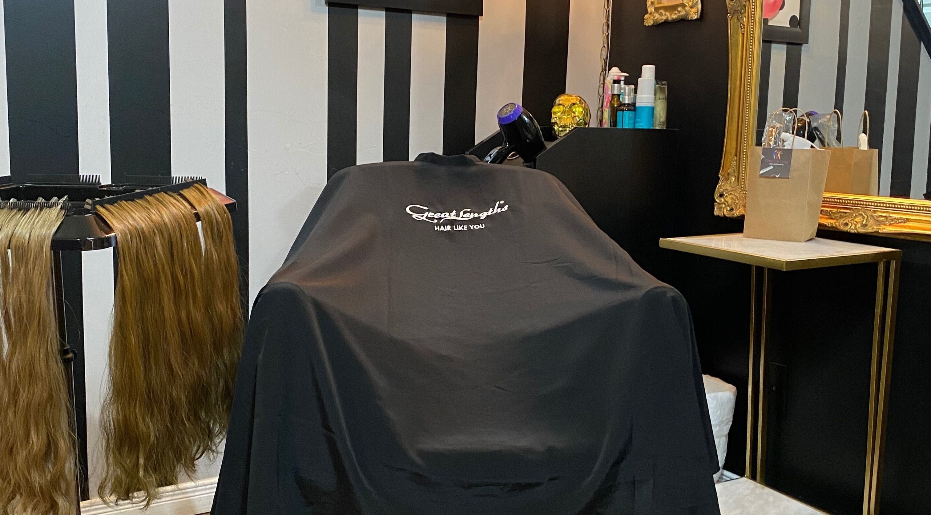 Styling chair at The Coven Extension Studio, Ottawa, Ontario, CA with hair extensions and beauty products.