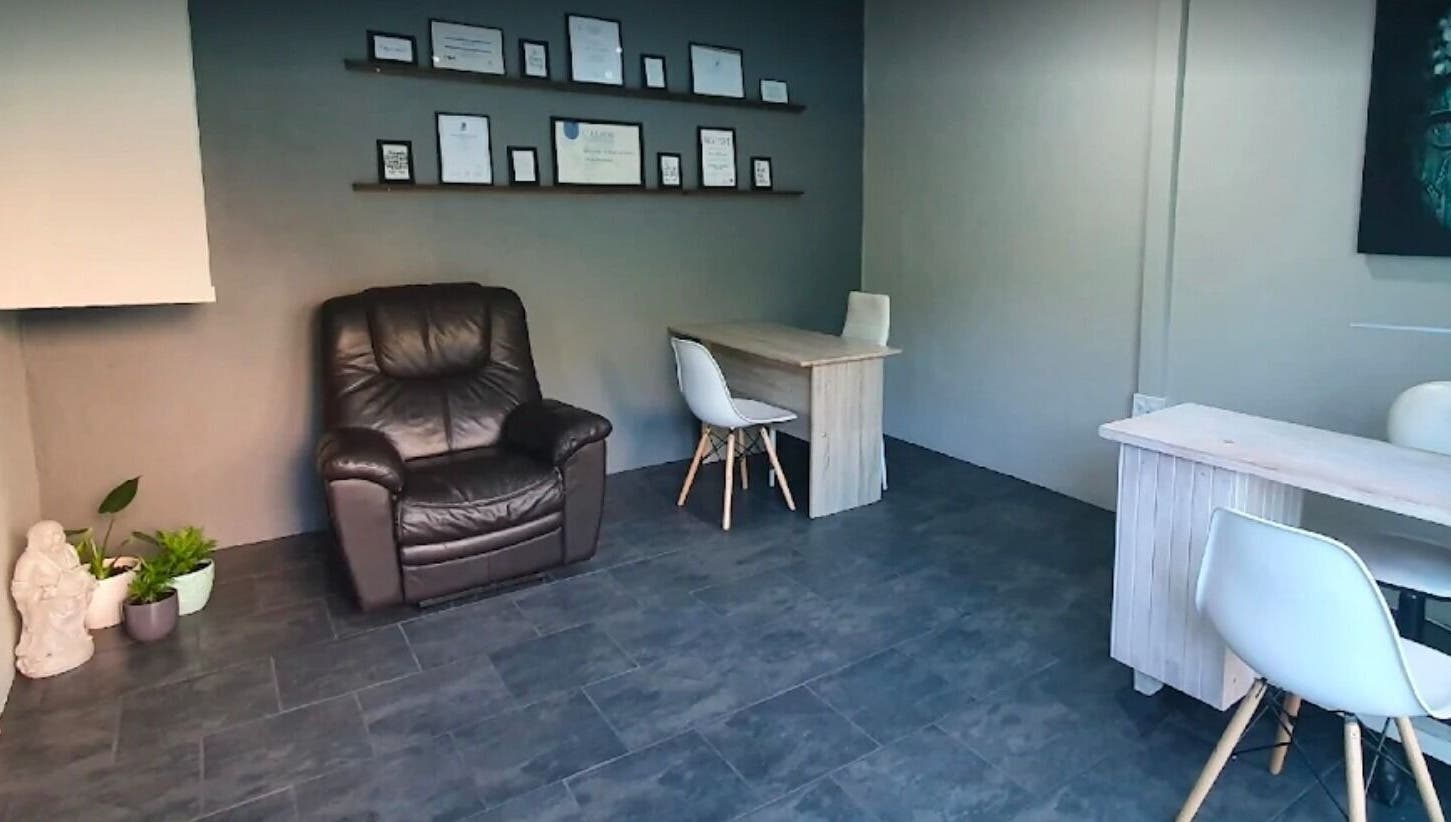 Cozy relaxation corner with chair and desk at ALS Beauty, Cape Town, Western Cape, ZA.