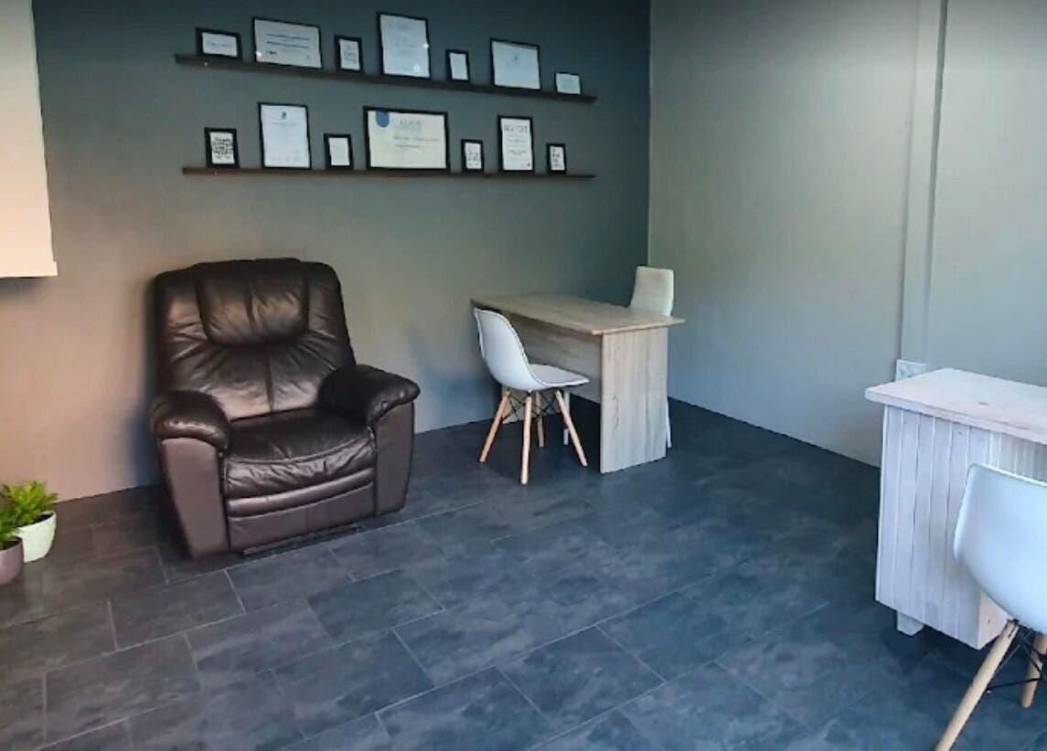Cozy relaxation corner with chair and desk at ALS Beauty, Cape Town, Western Cape, ZA.