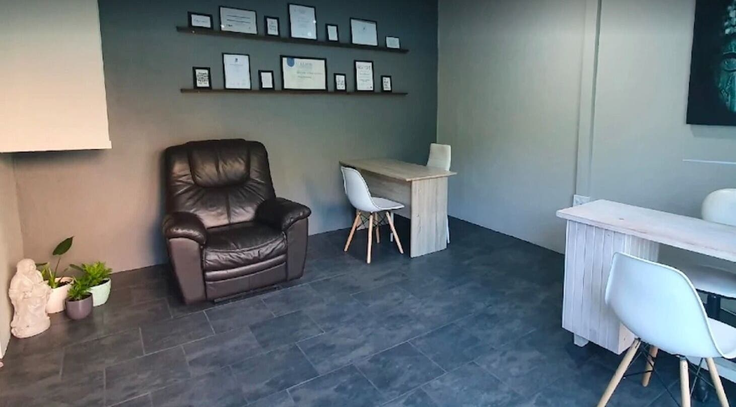 Cozy relaxation corner with chair and desk at ALS Beauty, Cape Town, Western Cape, ZA.