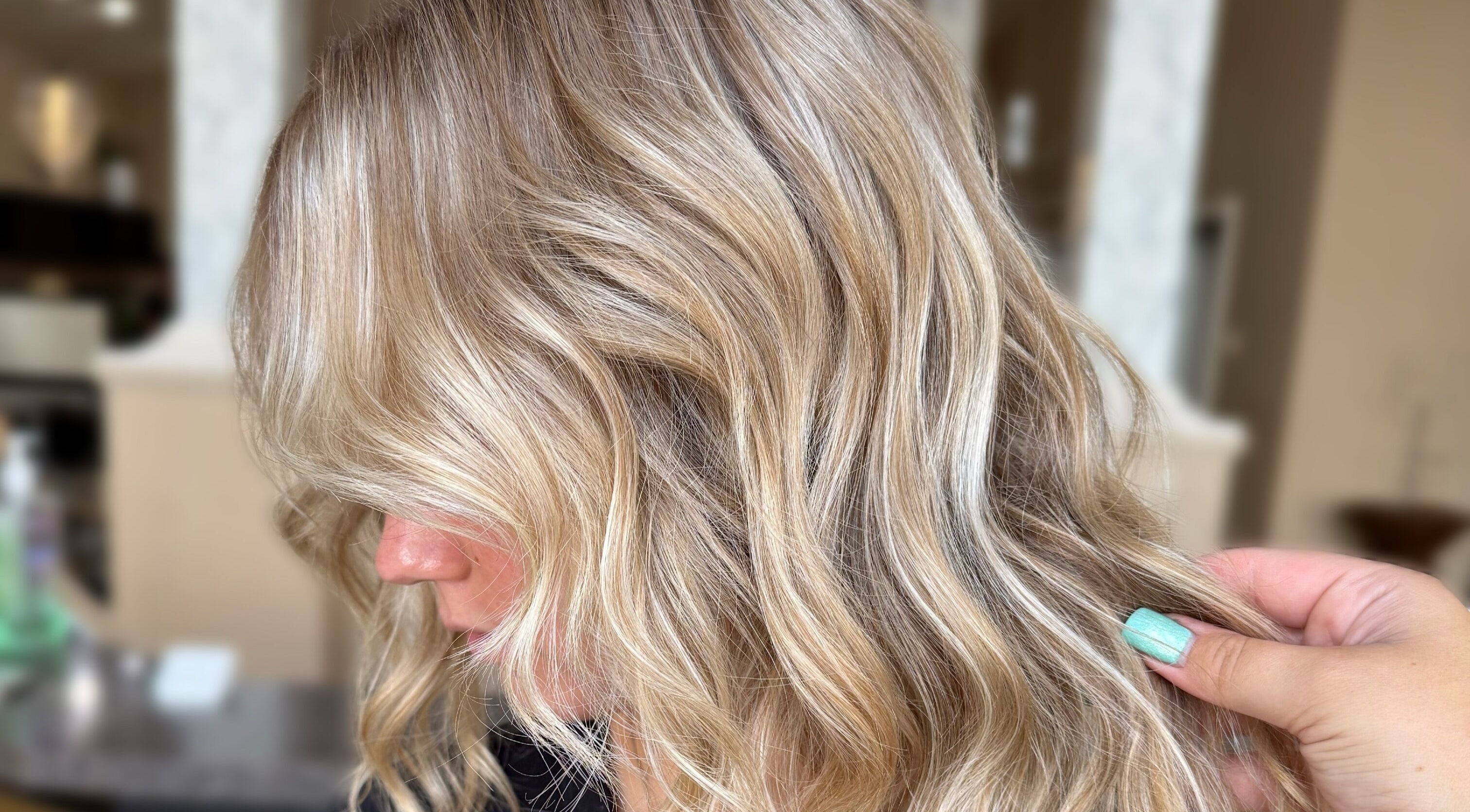 Blonde wavy hairstyle by Style by Sarah Bode at Navari Hair Studio, Cadillac, Michigan, US.