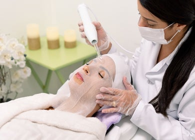 Aesthetician performing a facial treatment at Fran Bonfim Aesthetics in Margate, Florida, US.