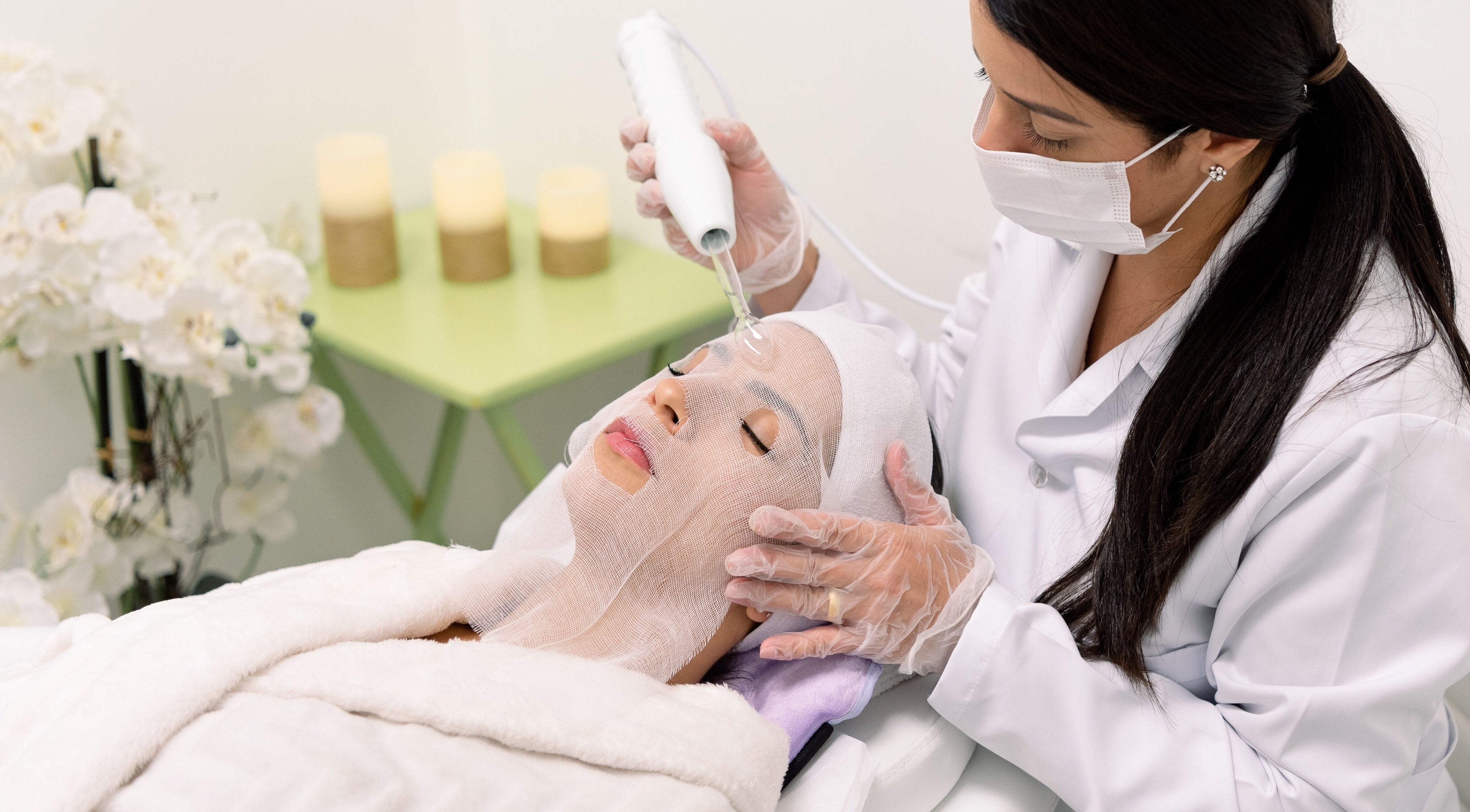 Aesthetician performing a facial treatment at Fran Bonfim Aesthetics in Margate, Florida, US.