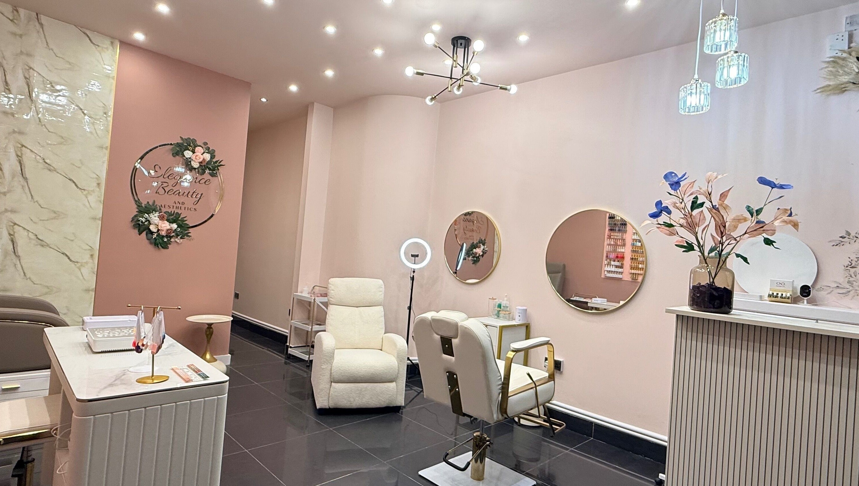 Elegant interior of Elegance Beauty and Aesthetics, London, England, GB with stylish chairs and decor.