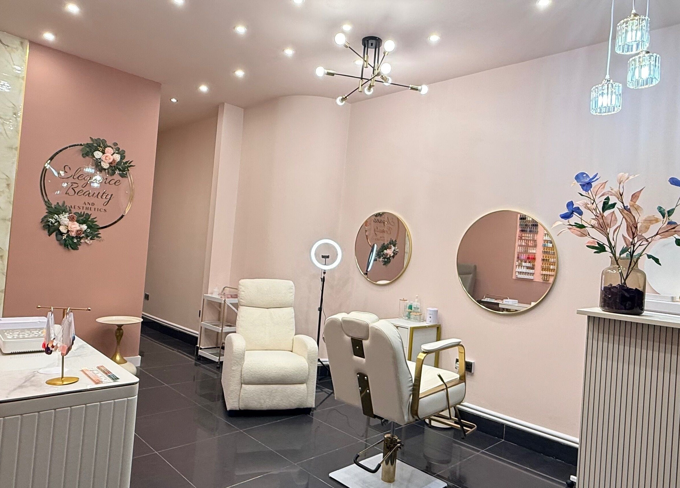 Elegant interior of Elegance Beauty and Aesthetics, London, England, GB with stylish chairs and decor.