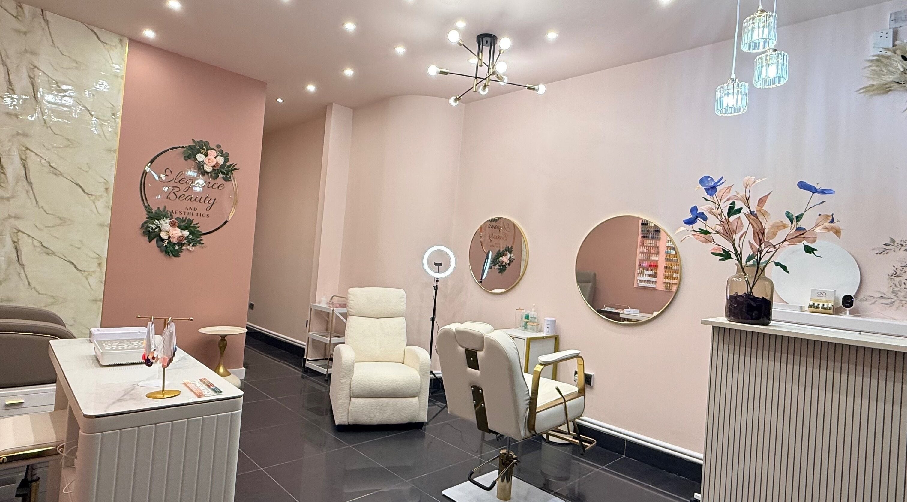 Elegant interior of Elegance Beauty and Aesthetics, London, England, GB with stylish chairs and decor.