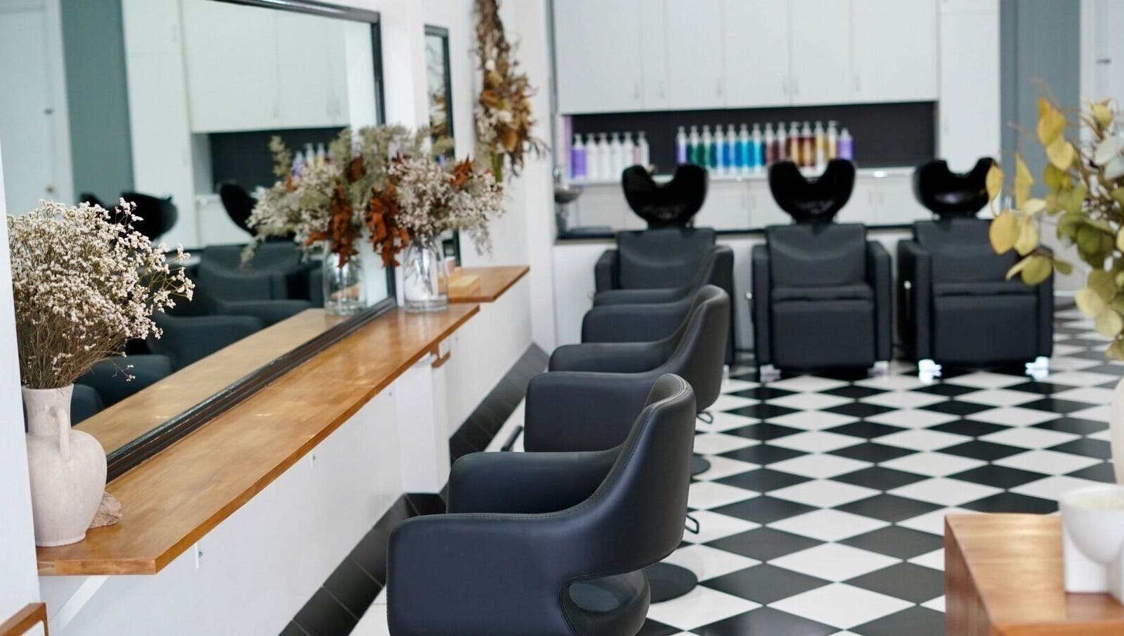 Stylish interior of Laura Jane Hair in Waratah, New South Wales, AU with chic salon furniture and decor.