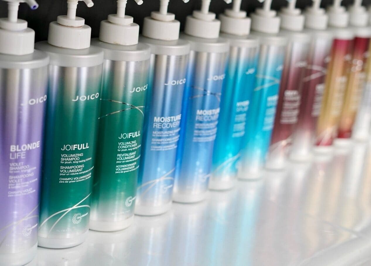 Colorful Joico shampoo bottles at Laura Jane Hair, Waratah, New South Wales, AU with vibrant energy.
