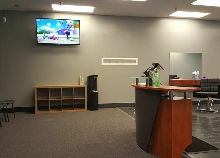 Modern interior of The Clip Joint salon in Yelm, Washington, US with a stylish seating area and reception.