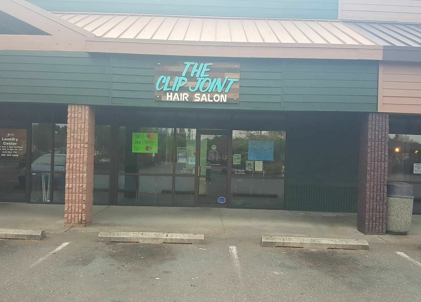 The Clip Joint storefront in Yelm, Washington, US, showcasing a welcoming salon entrance.
