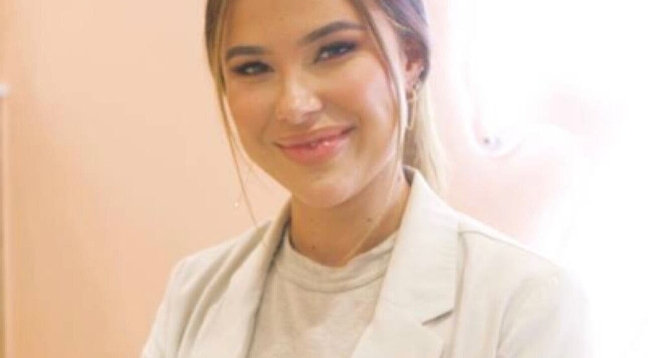 Staff member smiling inside Tyde Beauty Studio, Southport, Queensland, AU.