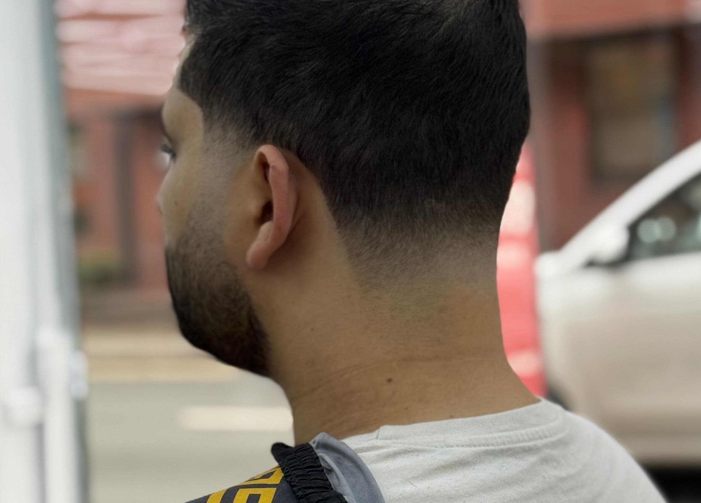Close-up of a fresh fade haircut at Barber 36 in Birmingham, England, GB, showcasing modern styling.