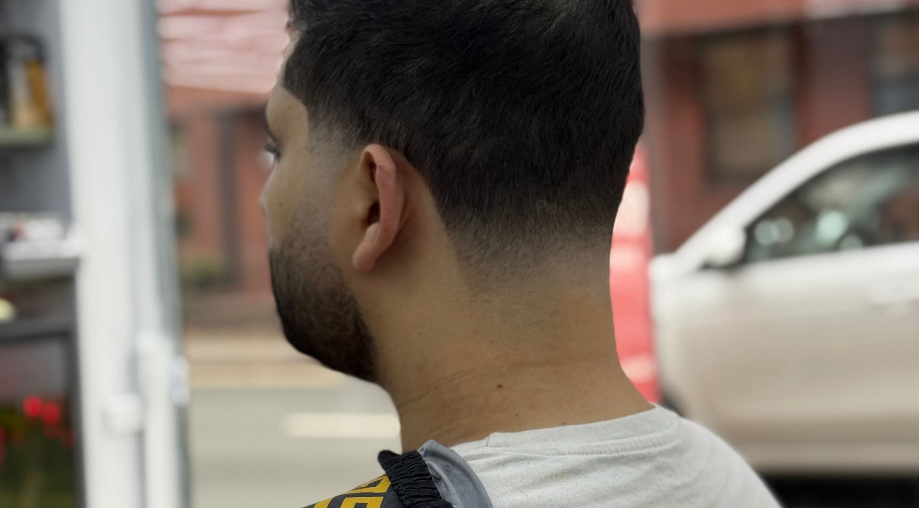 Close-up of a fresh fade haircut at Barber 36 in Birmingham, England, GB, showcasing modern styling.