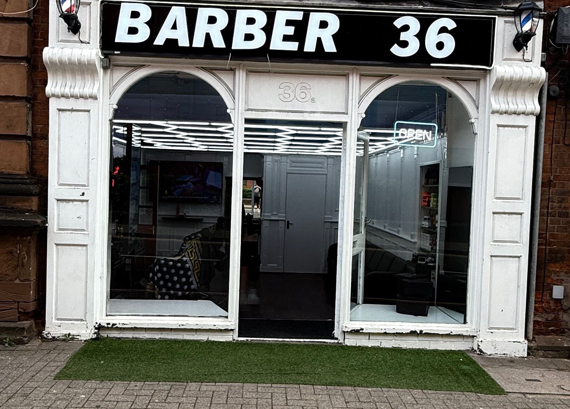 Exterior of Barber 36 in Birmingham, England, GB, showcasing sleek and modern storefront design.