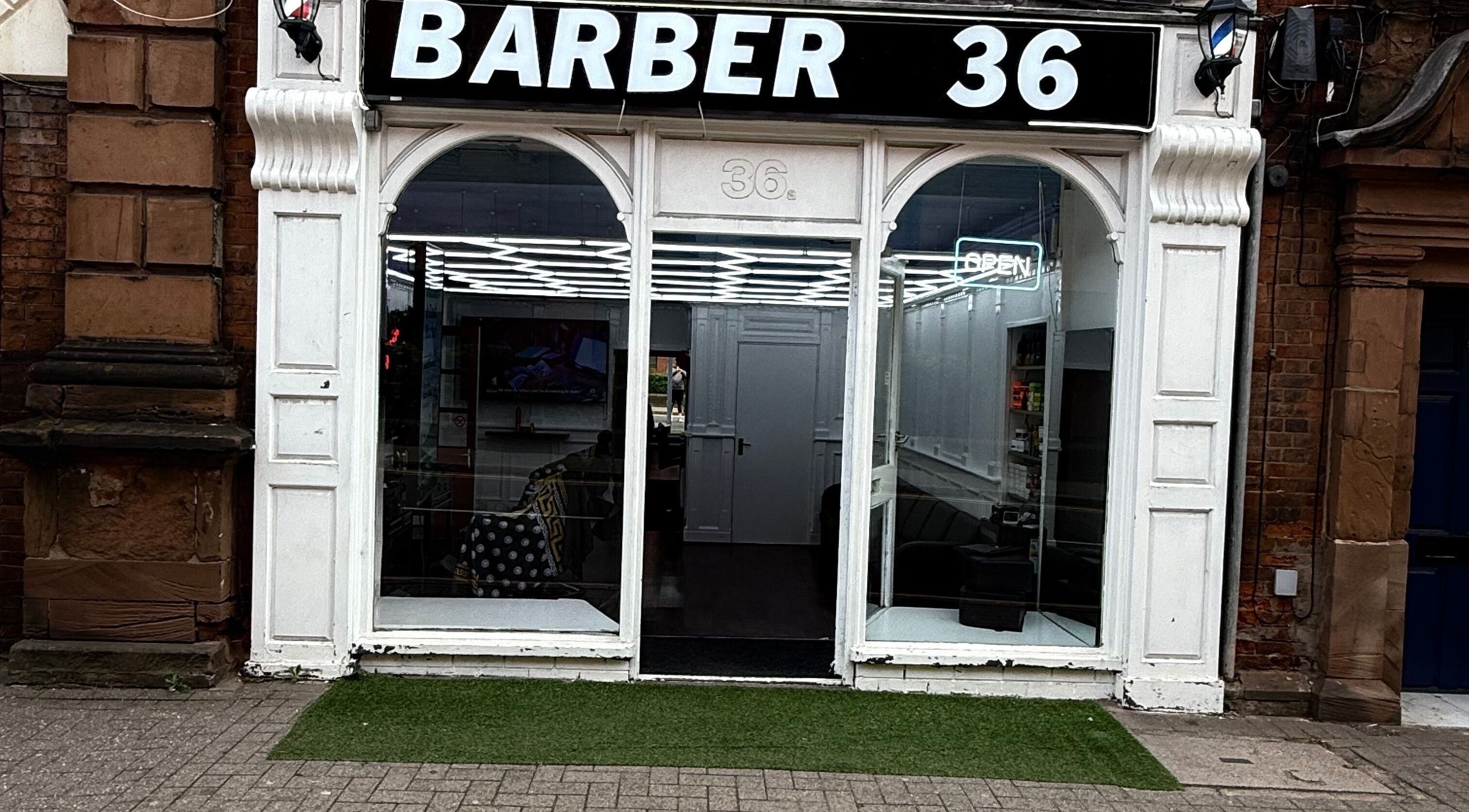 Exterior of Barber 36 in Birmingham, England, GB, showcasing sleek and modern storefront design.