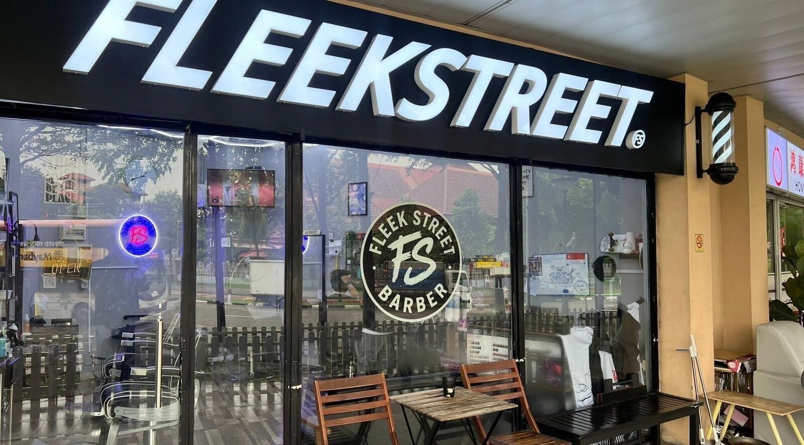 Exterior view of FleekStreet Barber with seating, located in Singapore, Singapore, SG.