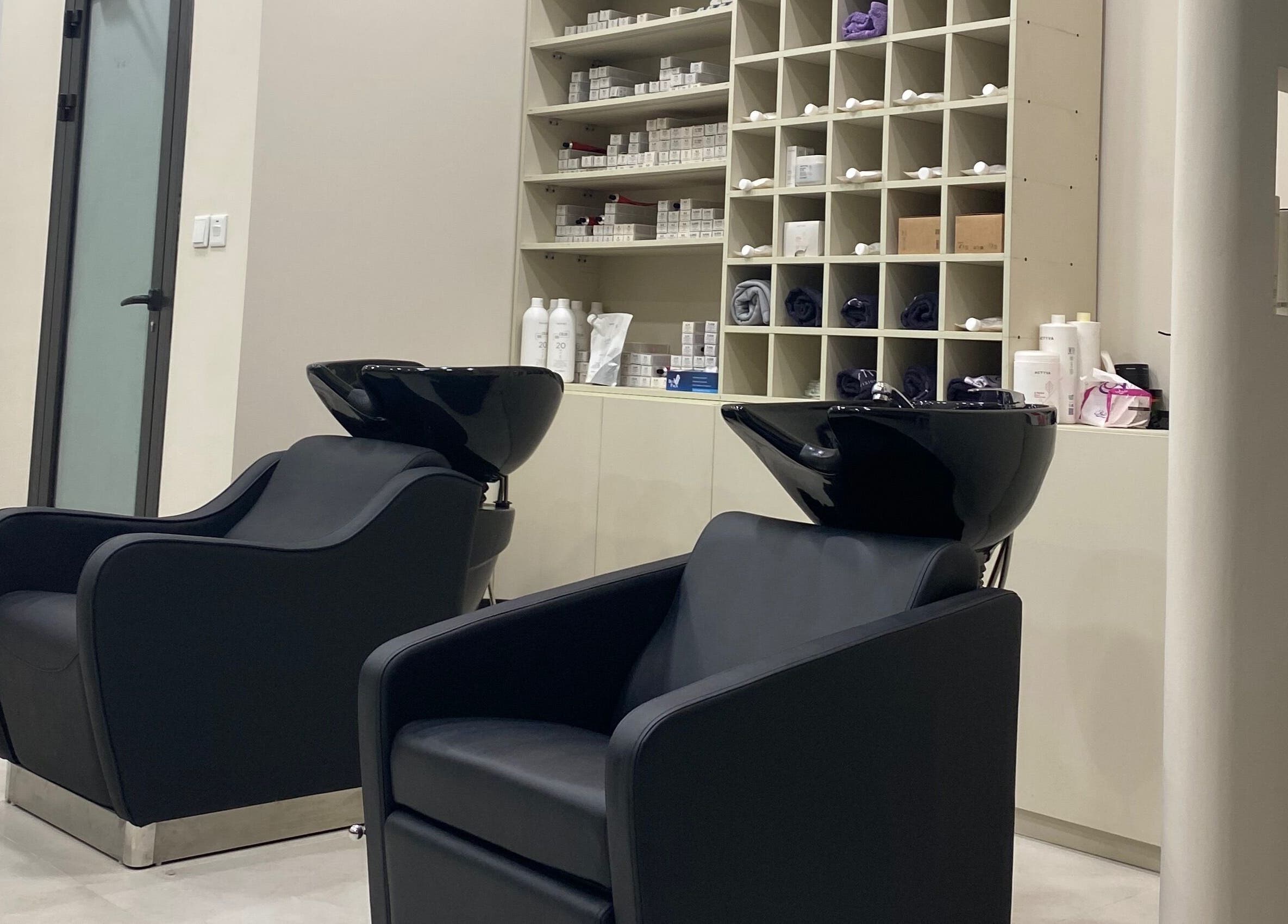 Modern wash stations at Hair & More by Hanan, Al Hidd, Muḥāfaẓat Al-muḥarraq, BH, designed for luxurious comfort.