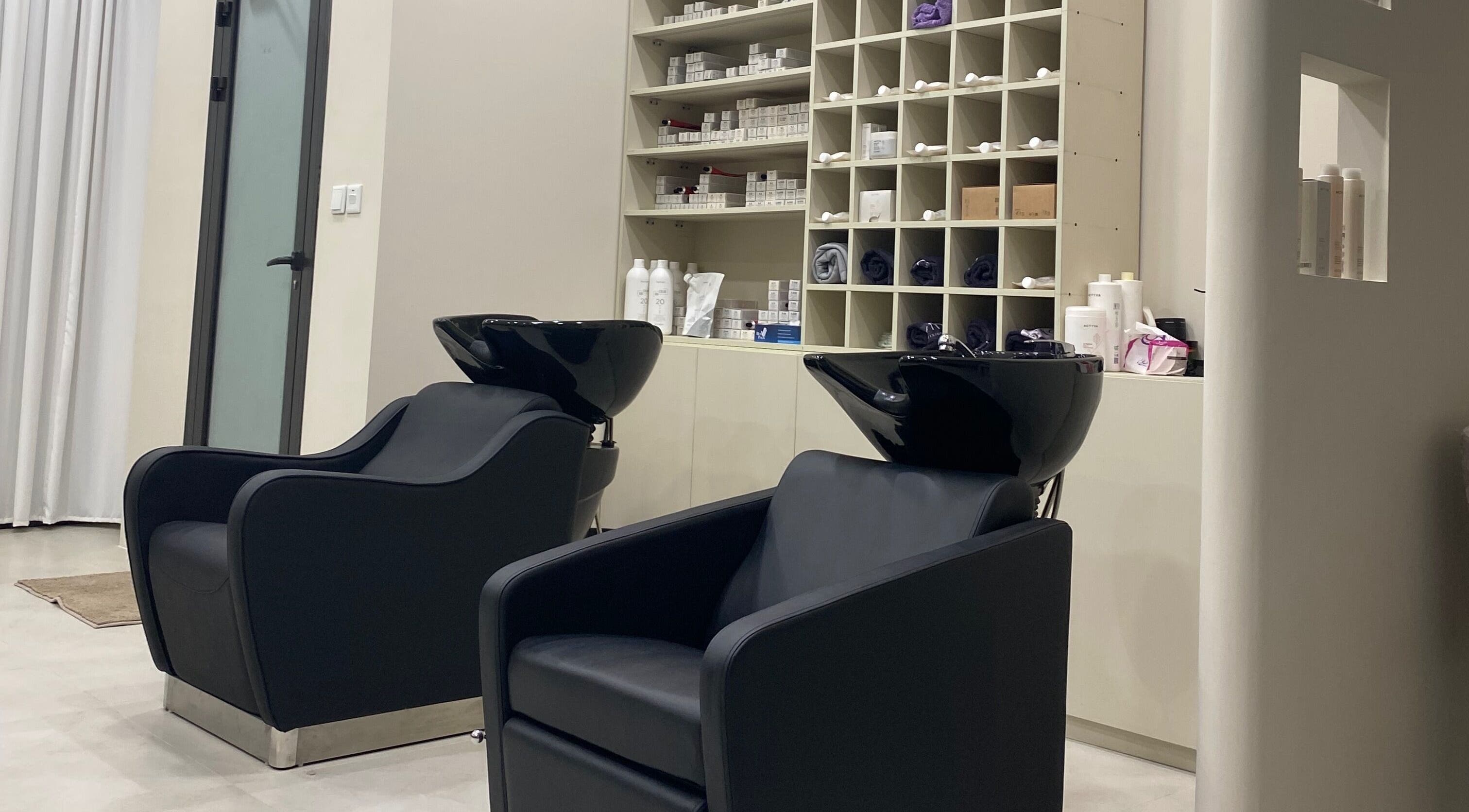 Modern wash stations at Hair & More by Hanan, Al Hidd, Muḥāfaẓat Al-muḥarraq, BH, designed for luxurious comfort.