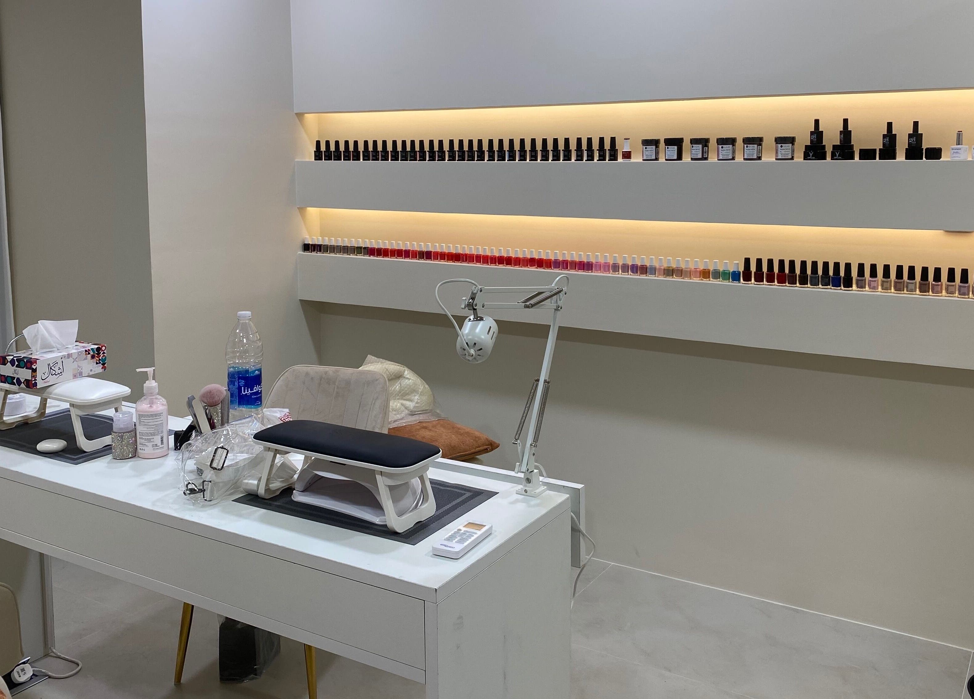 Interior of Hair & More by Hanan in Al Hidd, Muḥāfaẓat Al-muḥarraq, BH showcasing nail polish collection.