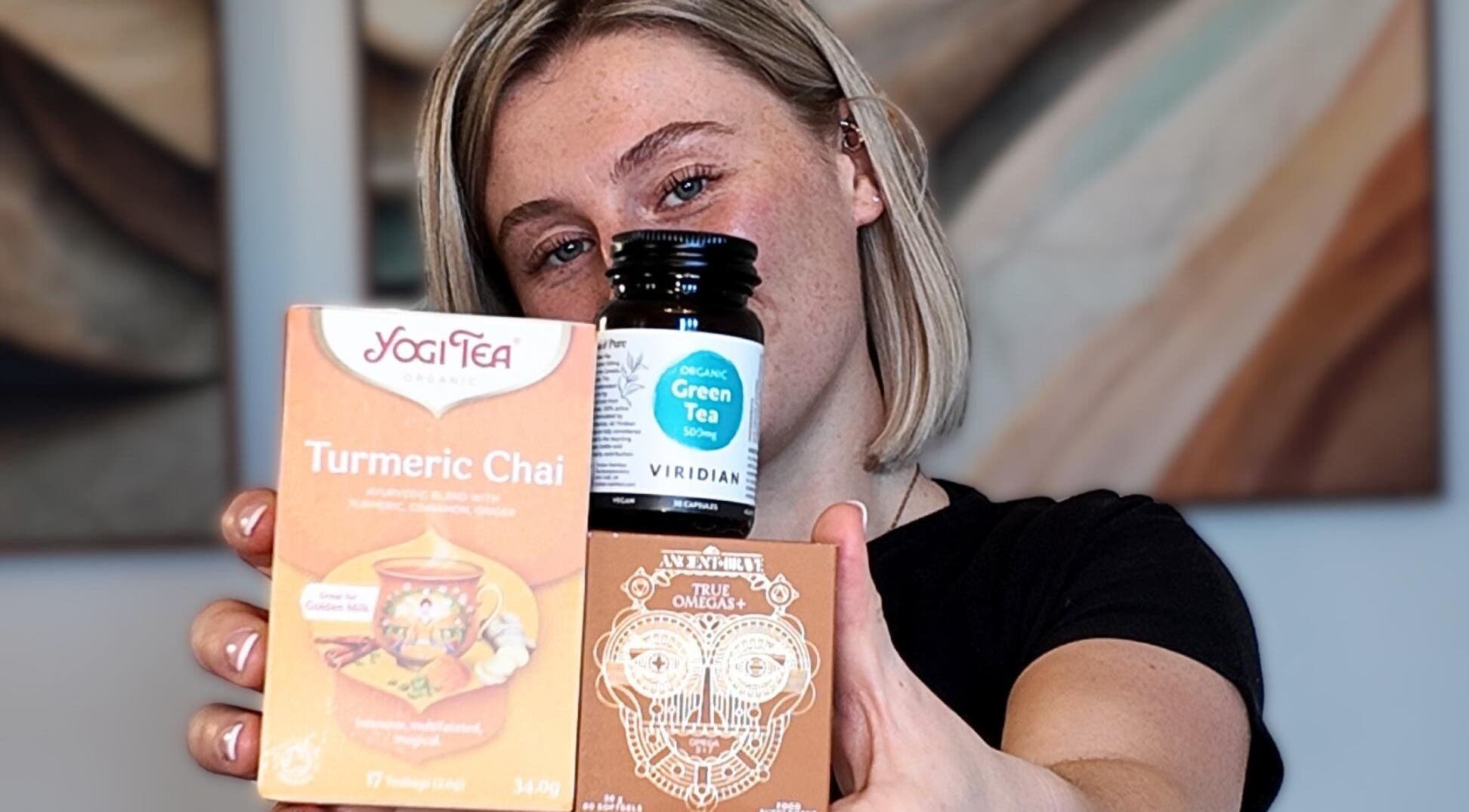 Person holding wellness teas and supplements at Lymph Luminé, Derby, England, GB.