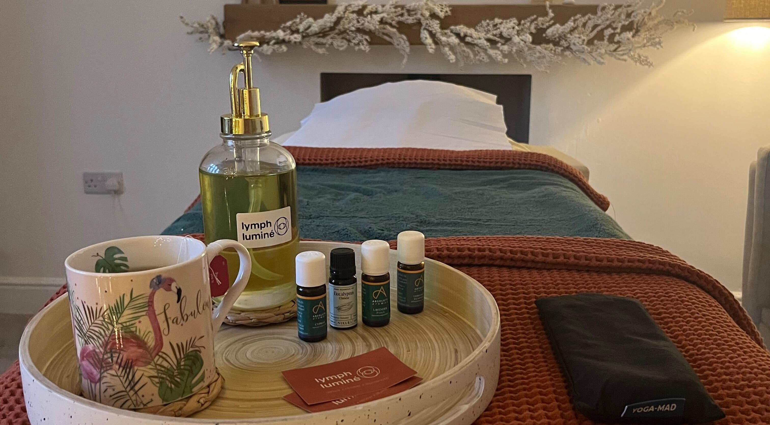 Tranquil massage setup at Lymph Luminé, Derby, England, GB featuring oils and a cozy treatment bed.