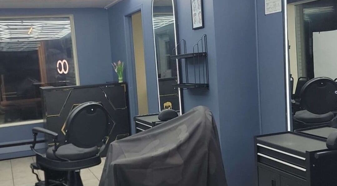 Elegant salon interior at Bobo Classique, Joliette, Québec, CA showcasing stylish decor and modern chairs.