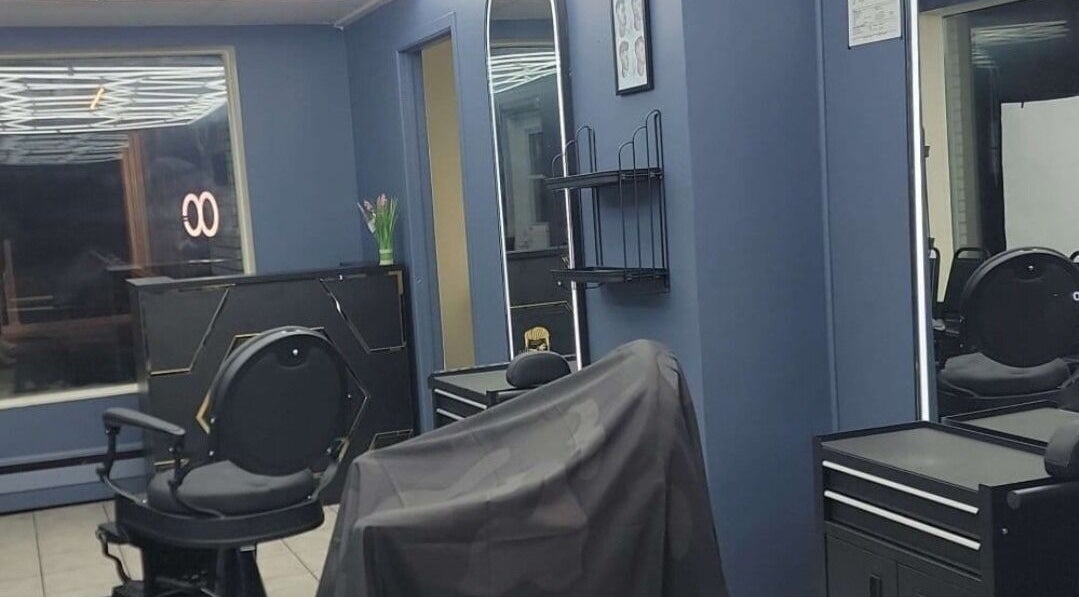 Elegant salon interior at Bobo Classique, Joliette, Québec, CA showcasing stylish decor and modern chairs.