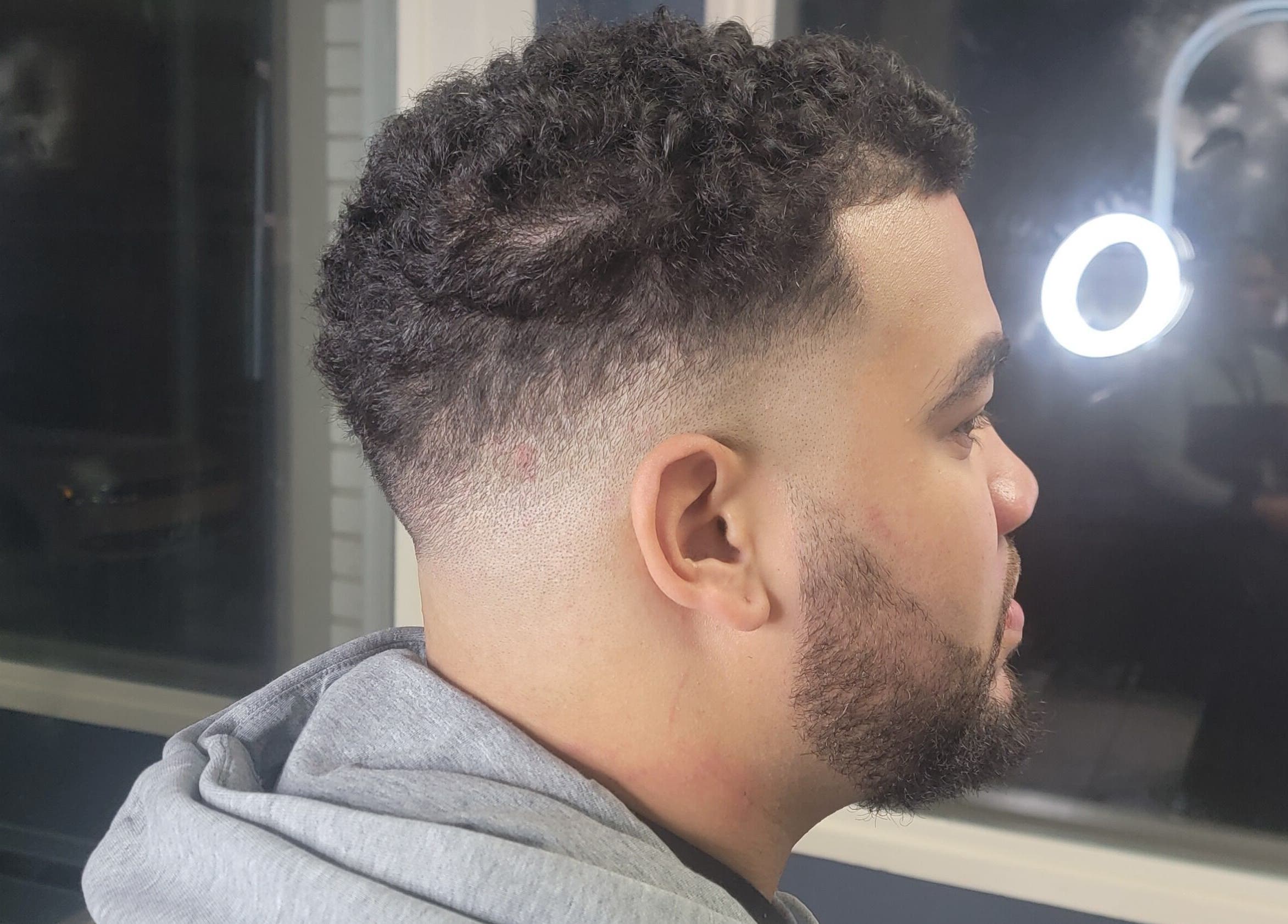 Clean fade haircut showcased at Bobo Classique, Joliette, Québec, CA.