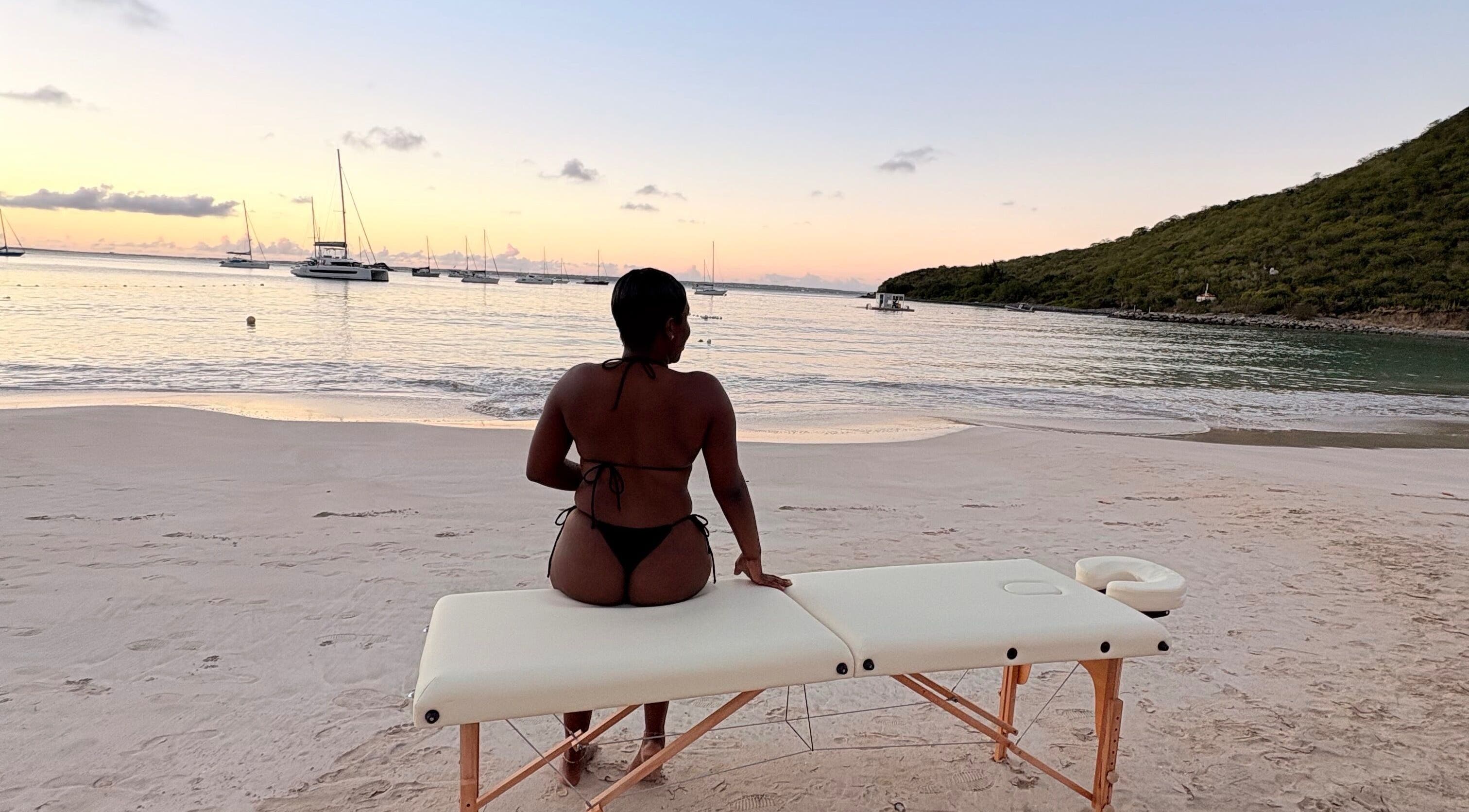 Relaxing beach massage setup at Theglamfactorysx/Thehealing haven, Marigot, MF at sunset.