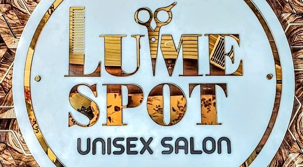 LumeSpot unisex salon logo sign in Greater Noida, Uttar Pradesh, India, featuring scissors and comb design.